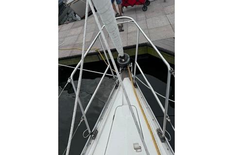 1986 Beneteau First 305 sailboat bow view at dock.