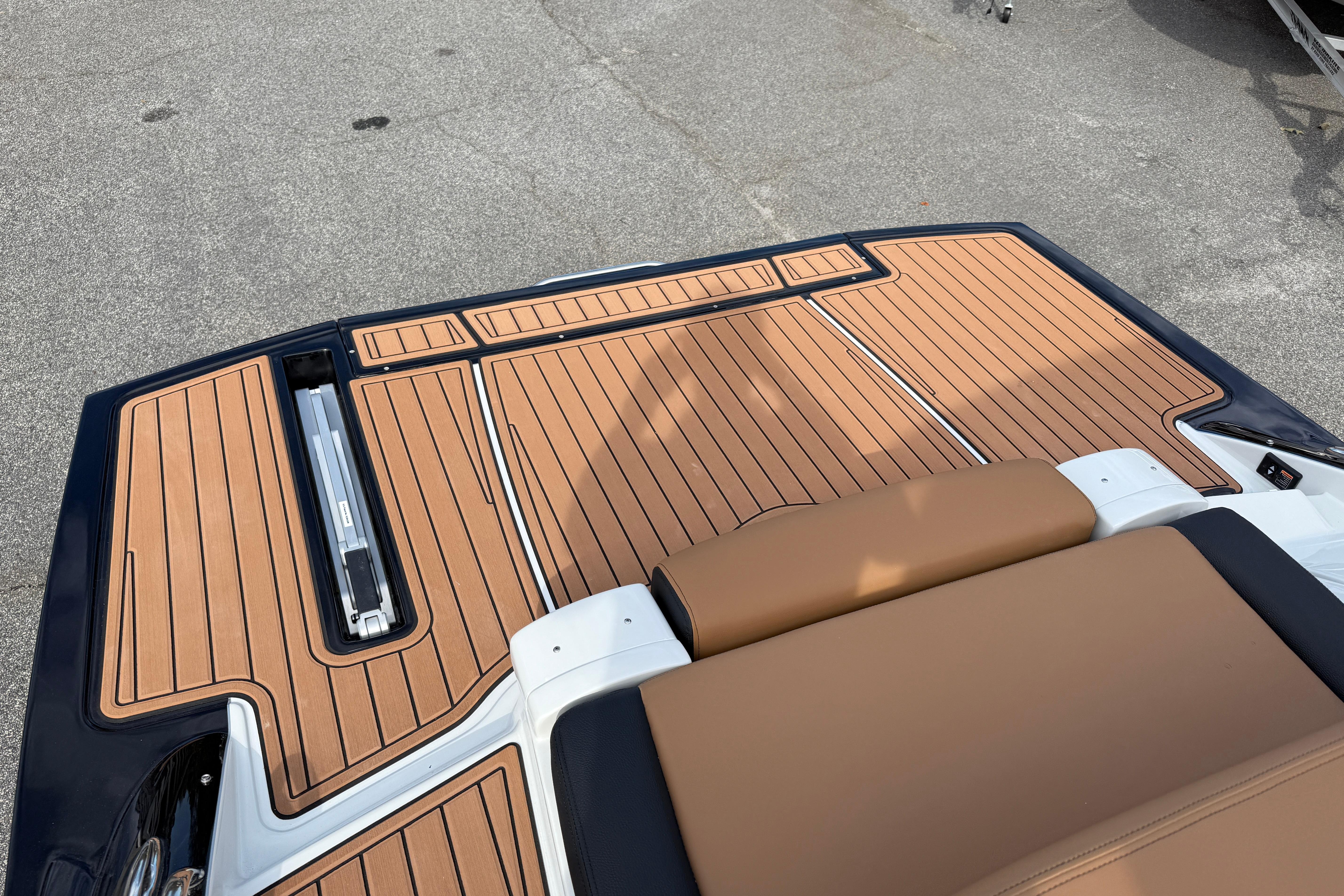 2026 Crownline 298 SS boat deck with sleek, modern teak flooring design.