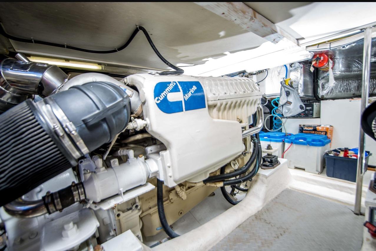 Engine room of 2000 Riviera 48 Enclosed Flybridge with Cummins Marine engine.