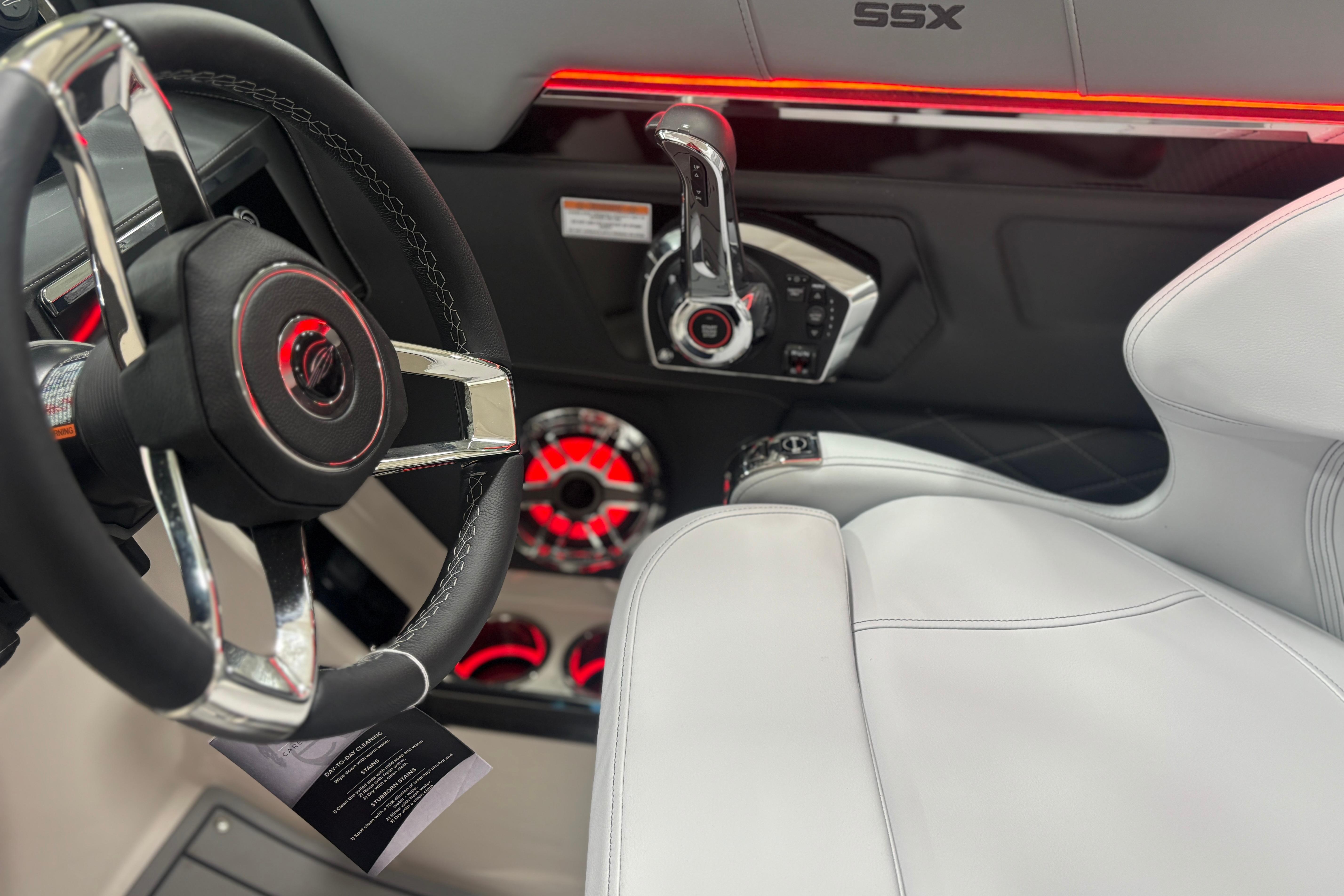 2026 Chaparral SSX 30 boat interior with steering wheel and modern controls.