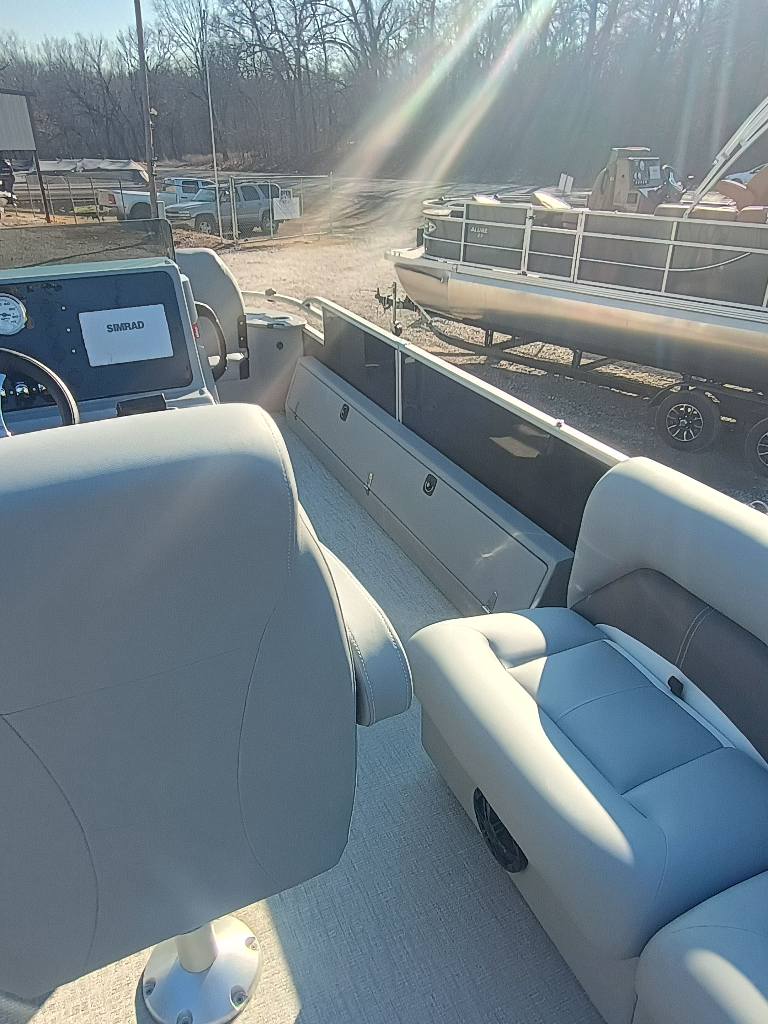 Interior of 2026 Landau Alure 25CC Fish-Black with gray seating.