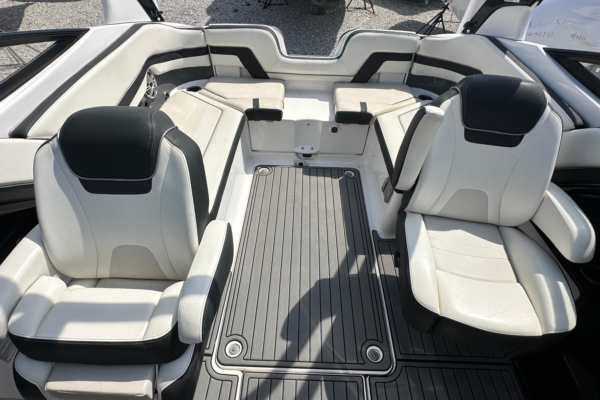 2016 Yamaha 242 Limited S boat interior with white and black seating.
