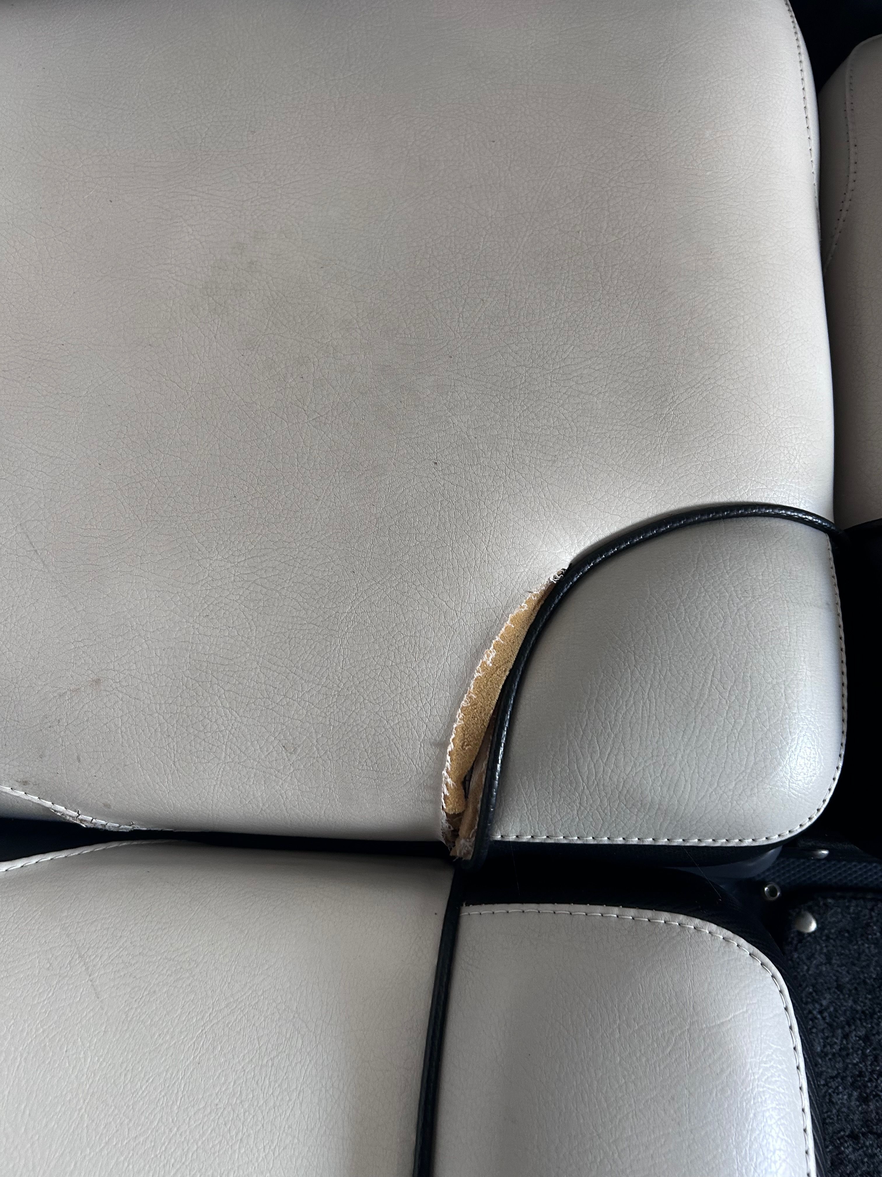 Damaged seat upholstery in a 2013 Axis A22 boat.