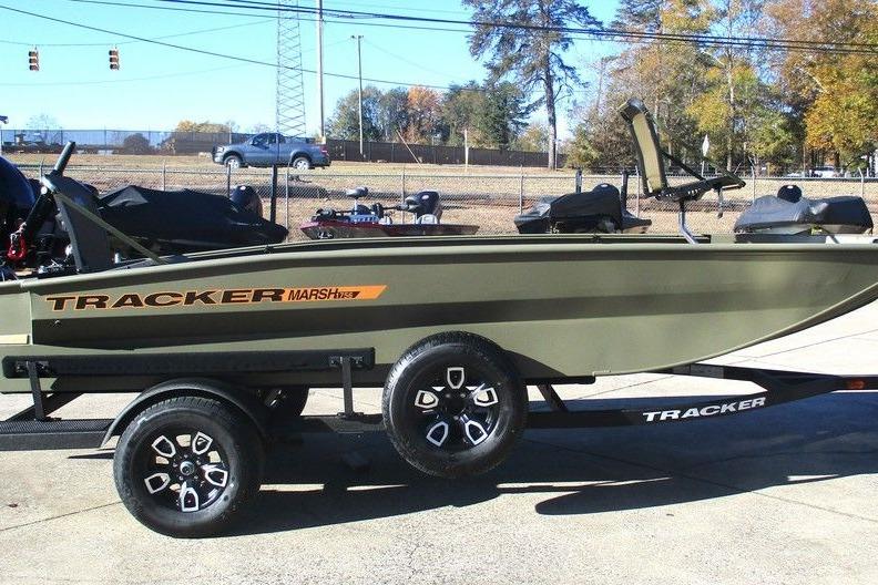2026 Tracker Grizzly 1756 T Marsh boat on trailer, parked outdoors.