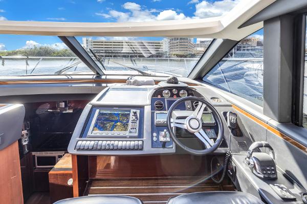 Interior view of 2013 Princess V57 yacht with modern helm console.