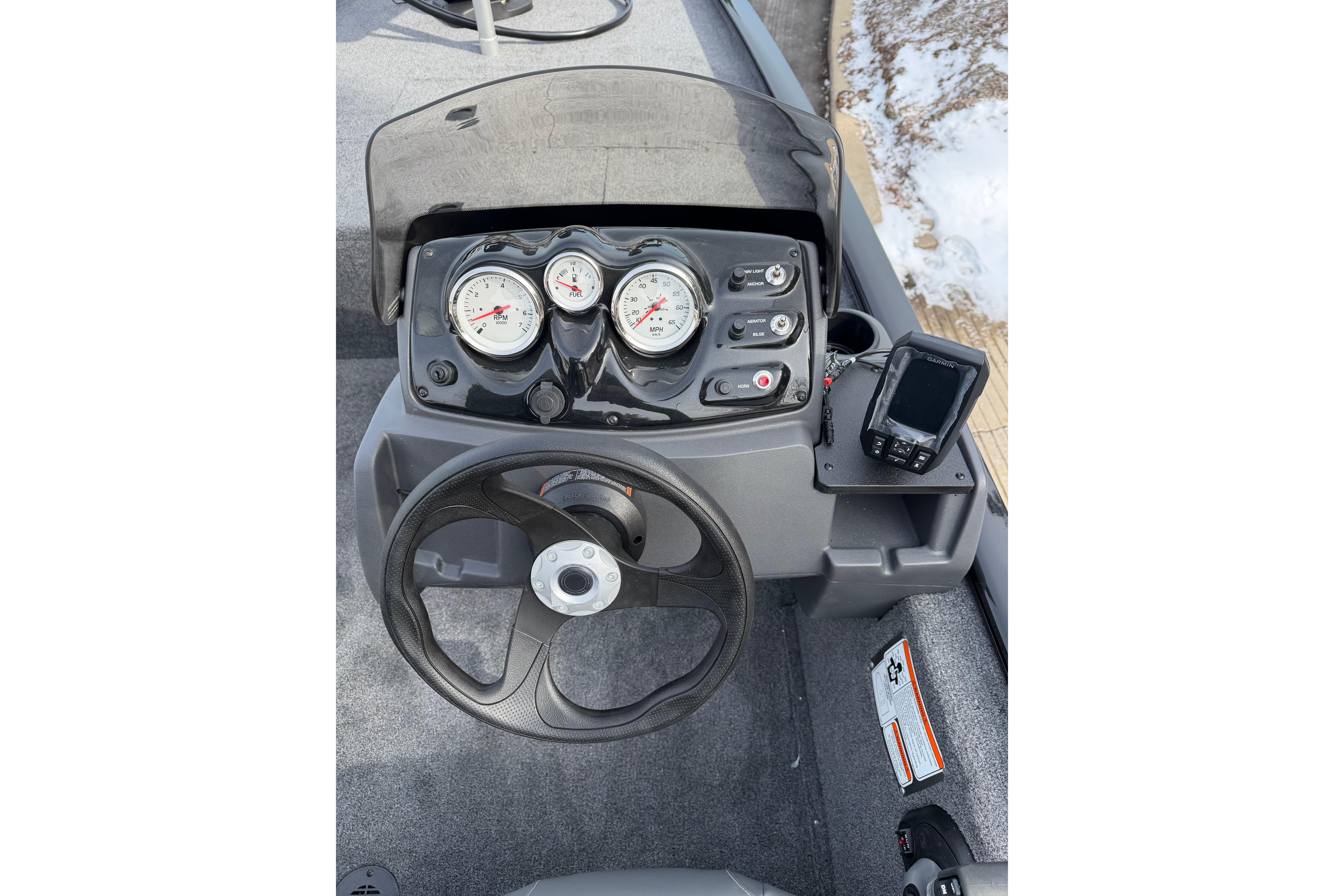 2026 Tracker Pro 170 boat dashboard with steering wheel and gauges.