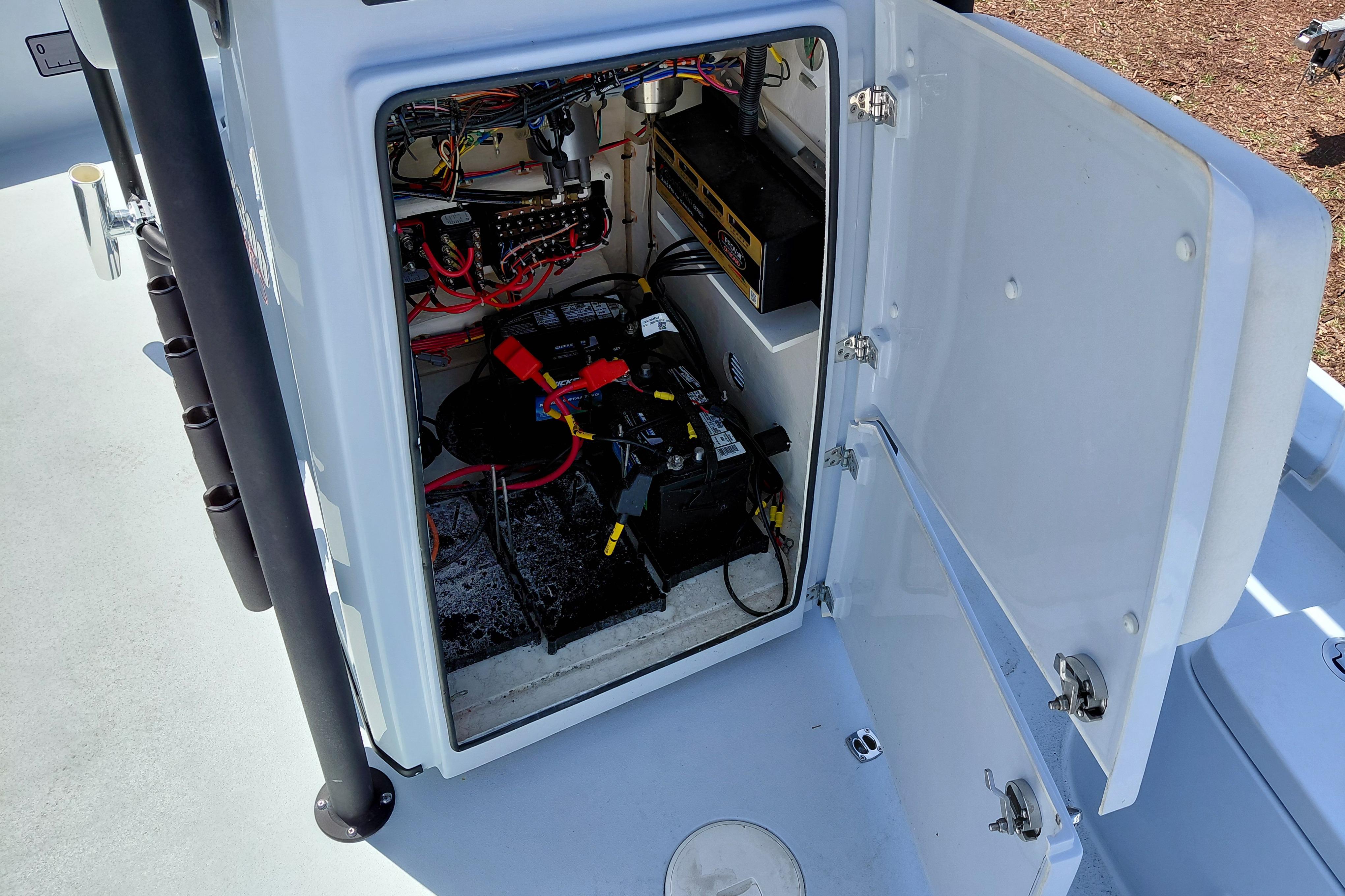 Open compartment of 2022 Pathfinder 2300 HPS boat showing battery and wiring.