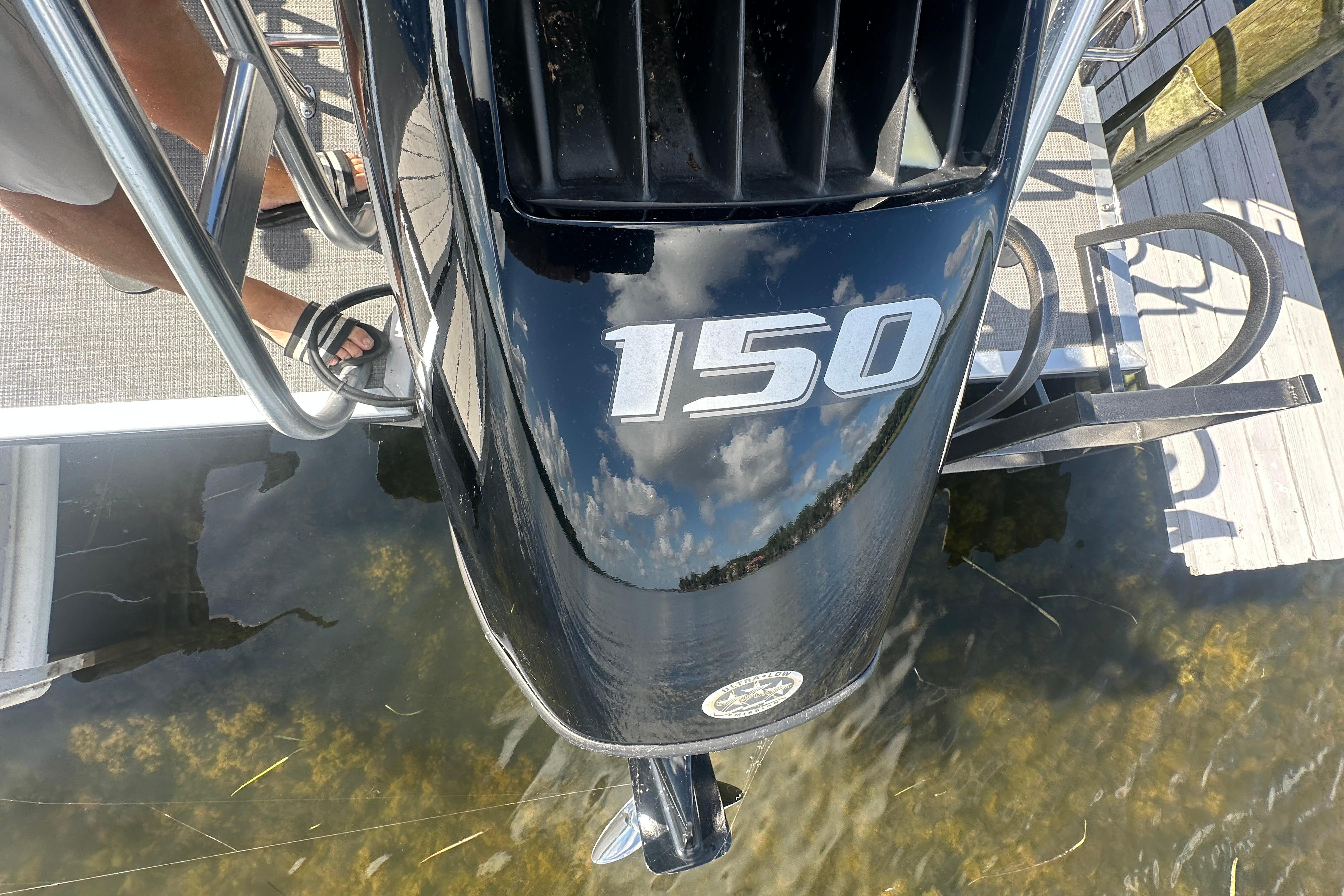 2023 Bentley Pontoons Legacy 243 Swingback with 150 HP engine, docked by water.