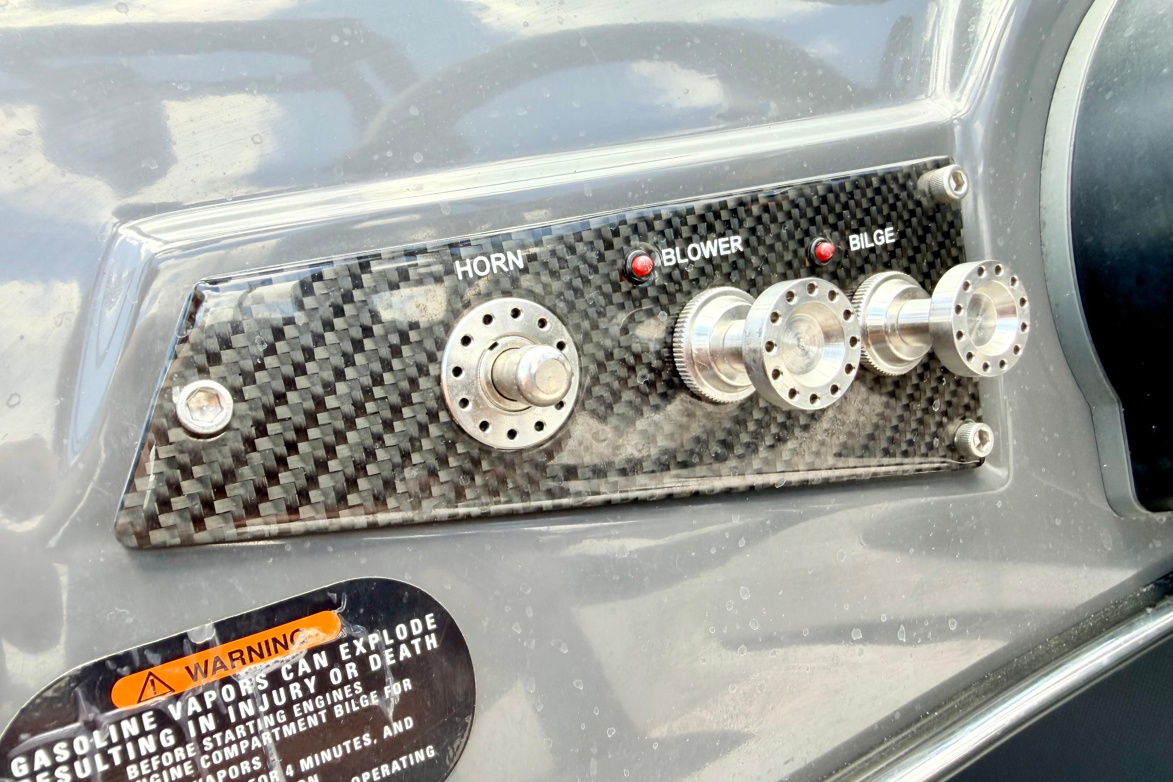 Control panel of a 2018 Glastron GT 185 boat with horn, blower, and bilge switches.