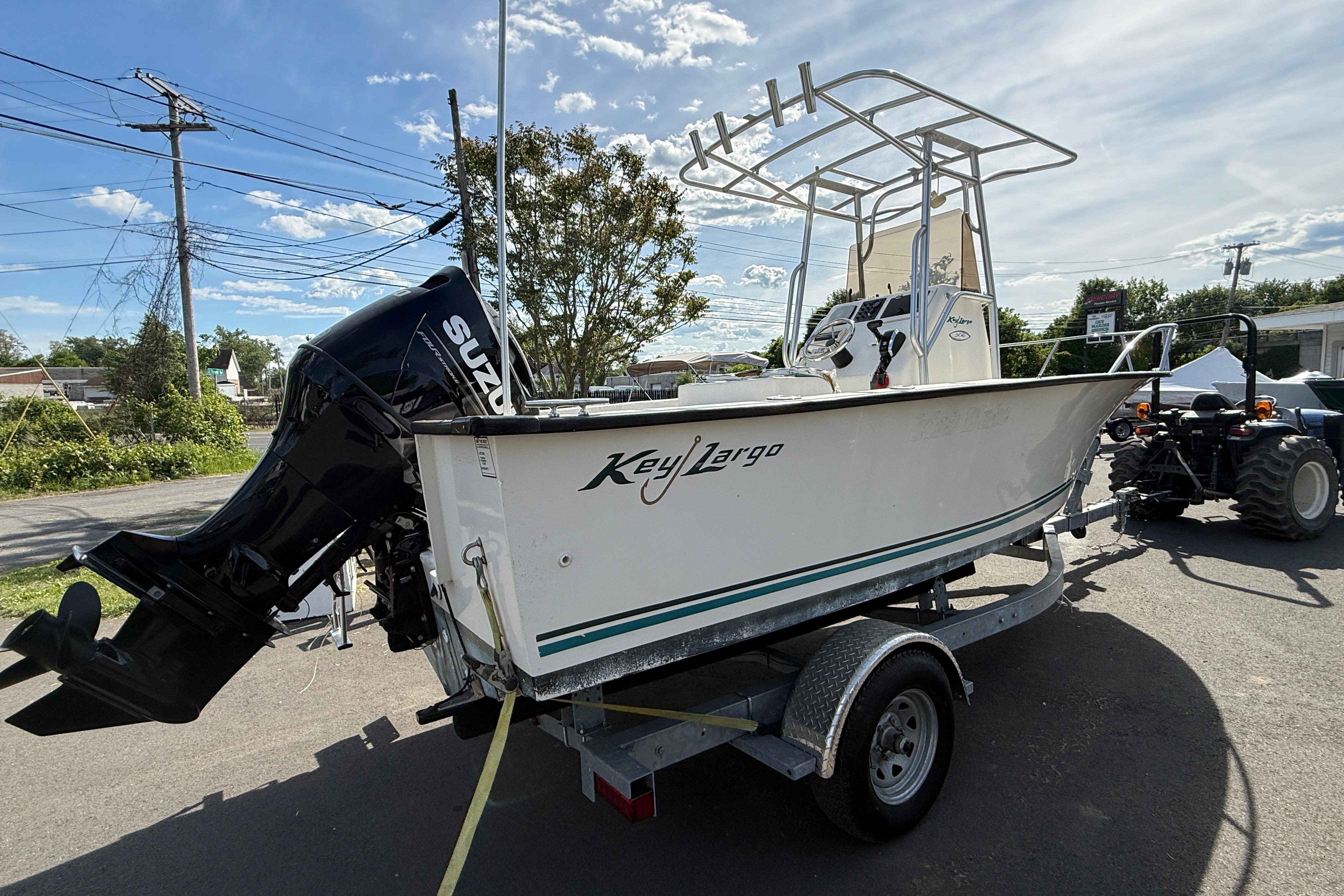 2008 Key Largo 206 Center Console boat on trailer with Suzuki outboard motor.
