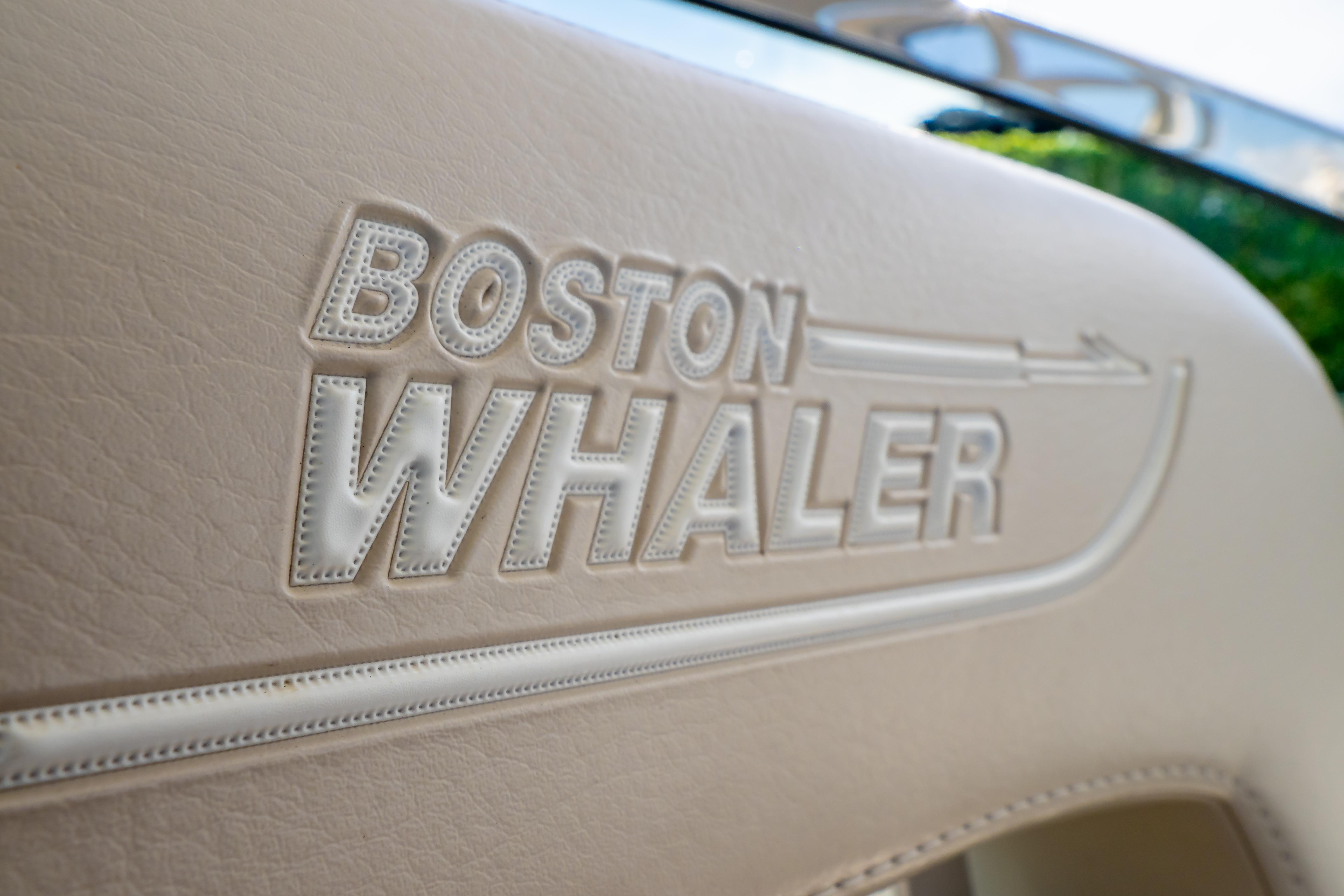 Close-up of embossed Boston Whaler logo on 2019 270 Vantage boat seat.
