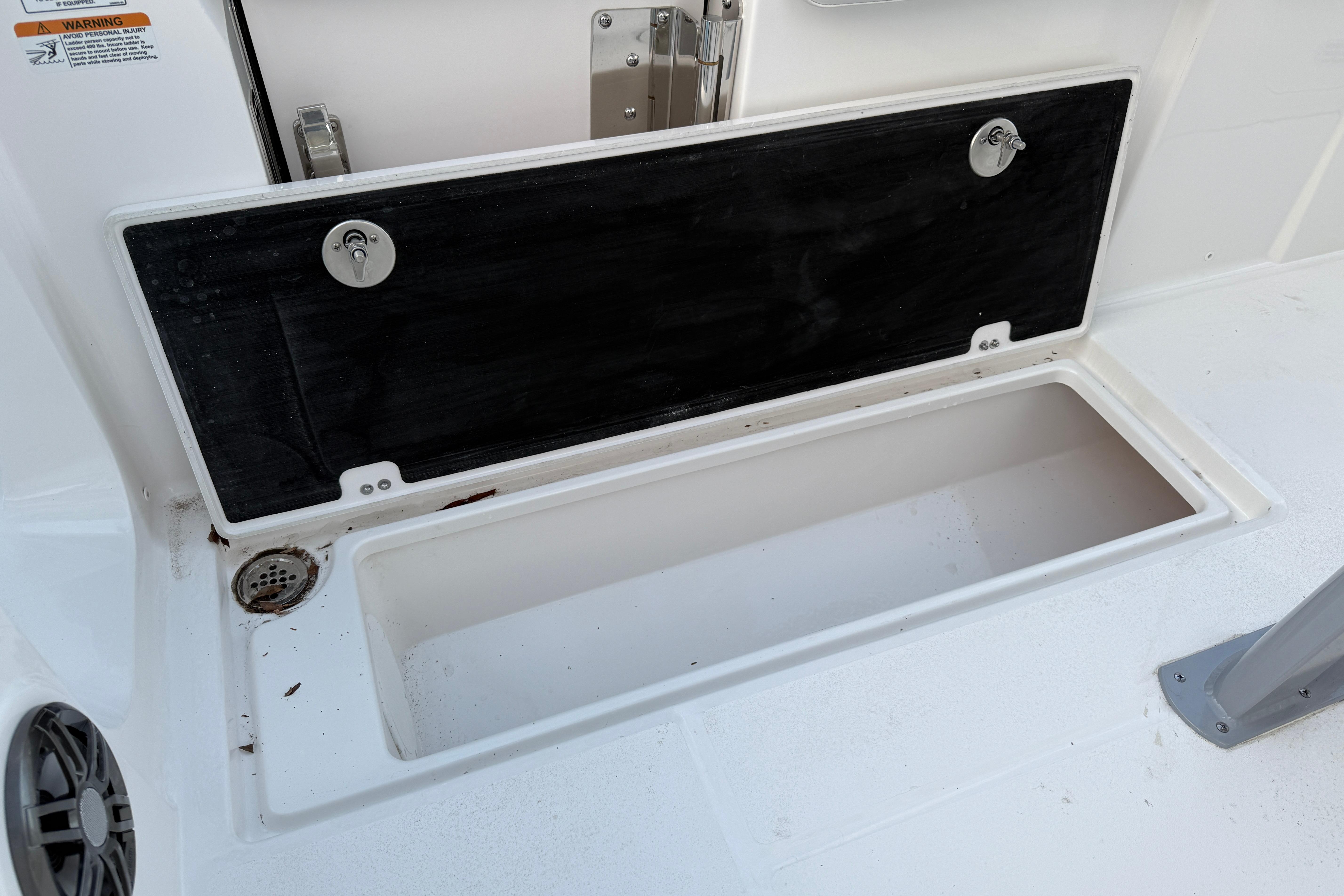 Open storage compartment on 2026 Sea Fox 268 Commander boat deck.