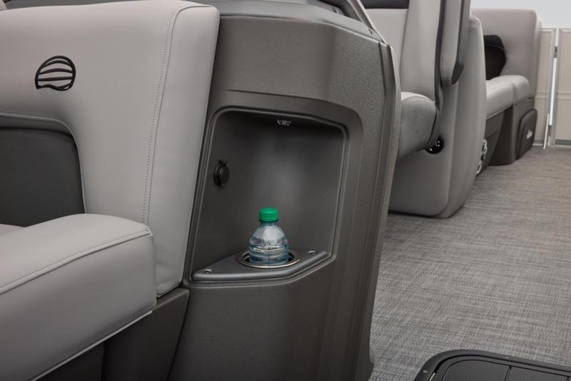 2026 Sun Tracker Party Barge 22 DLX interior with cup holder and seating.