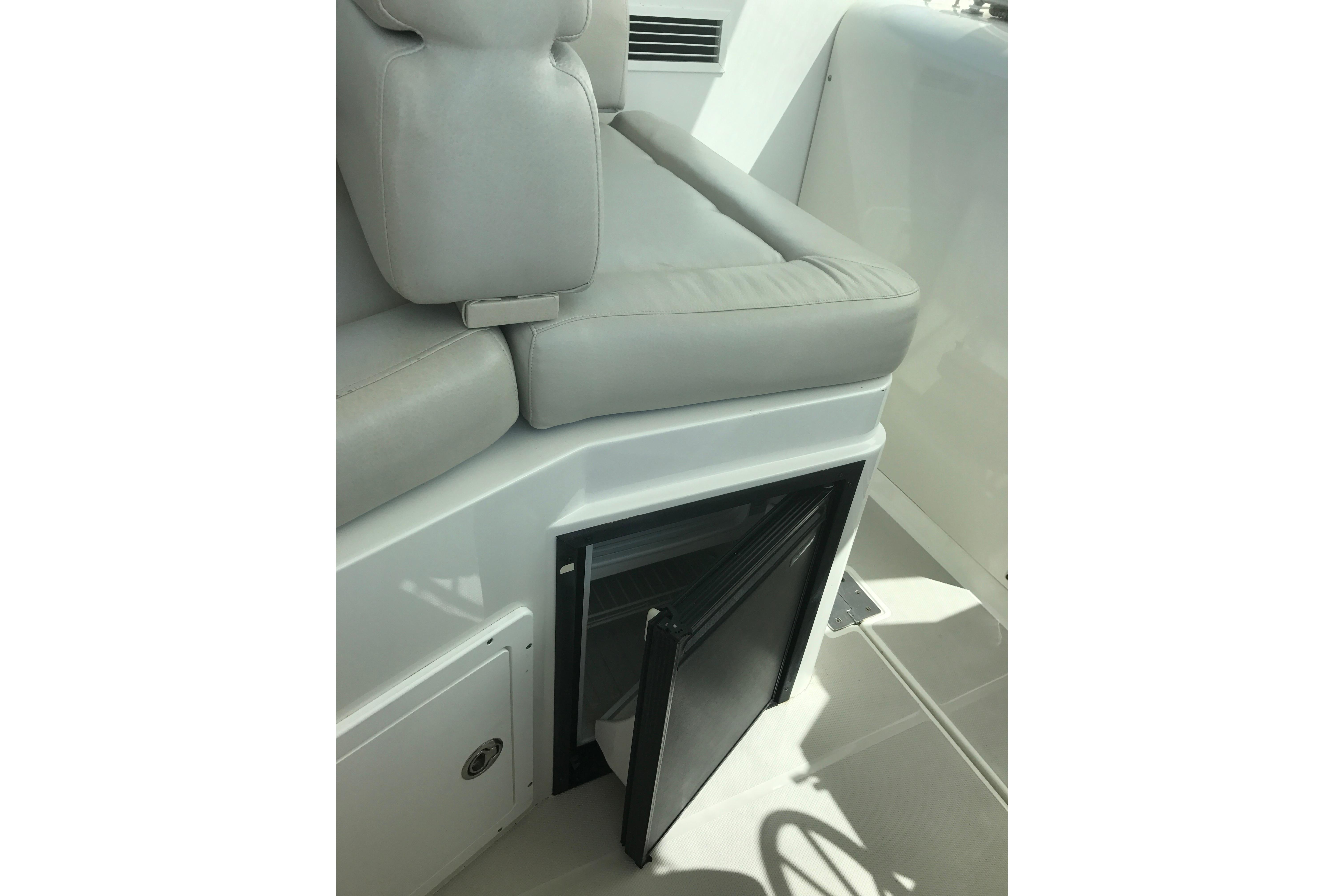 2008 Back Cove 33 boat interior with cushioned seating and open storage compartment.