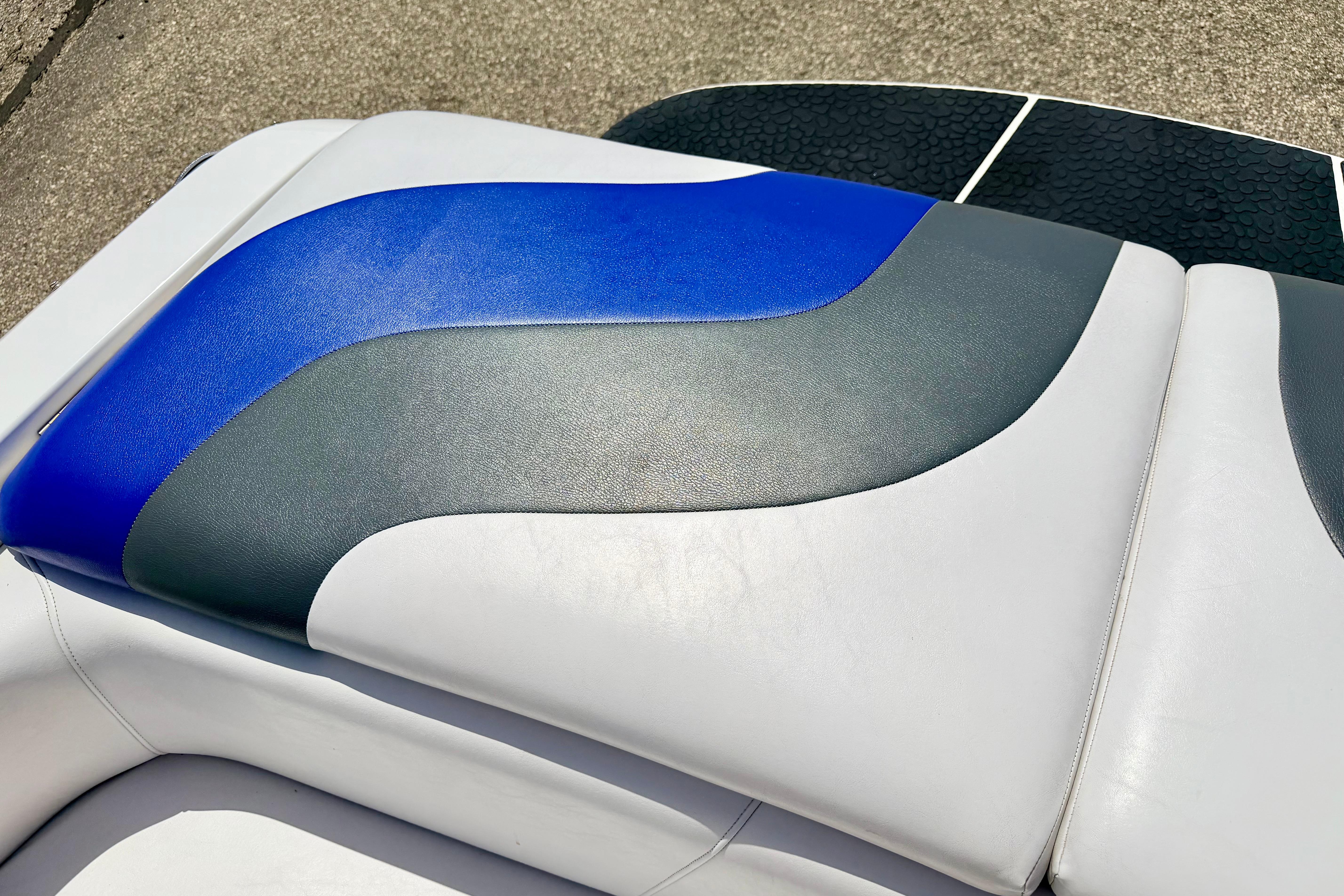 2008 Moomba Outback V boat seat with blue, gray, and white upholstery design.