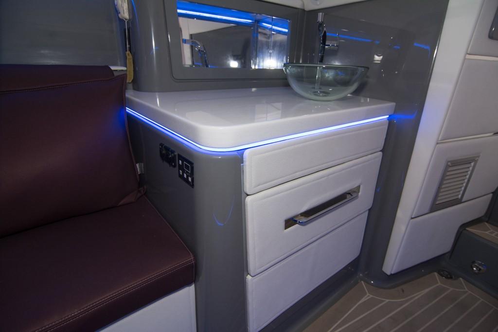 2019 Donzi 41 GT interior with modern cabinetry and LED lighting.