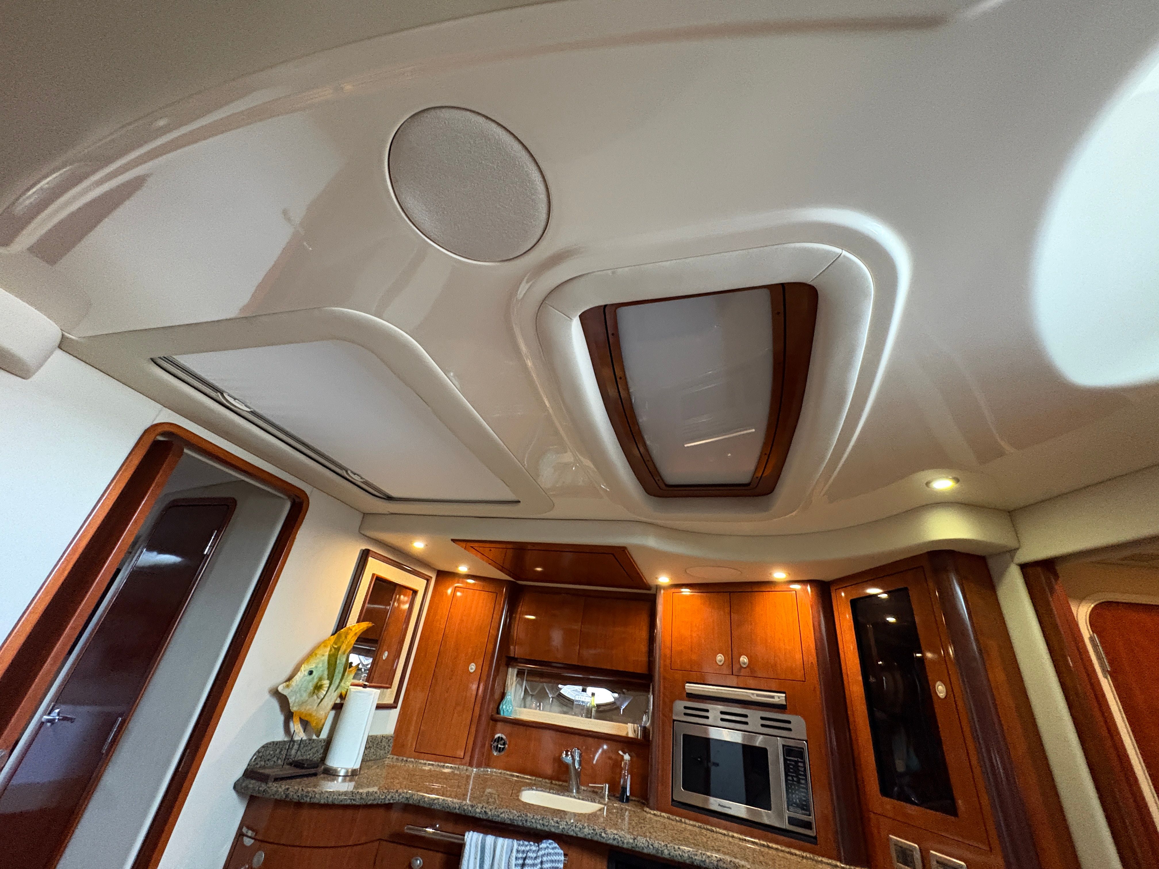 Interior of 2005 Sea Ray 420 Sundancer with modern kitchen.
