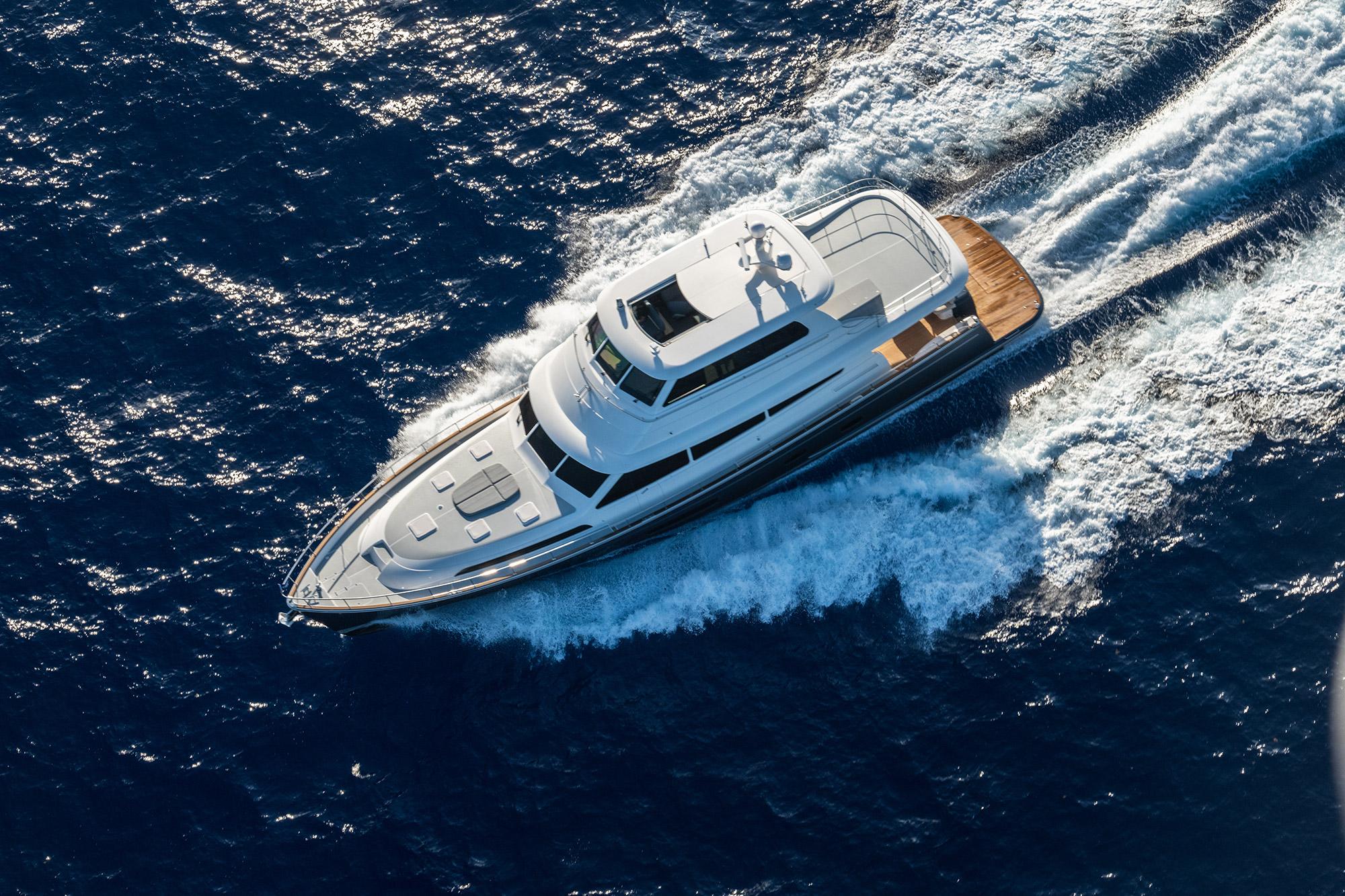 2026 Grand Banks GB 85 yacht cruising on open blue sea.
