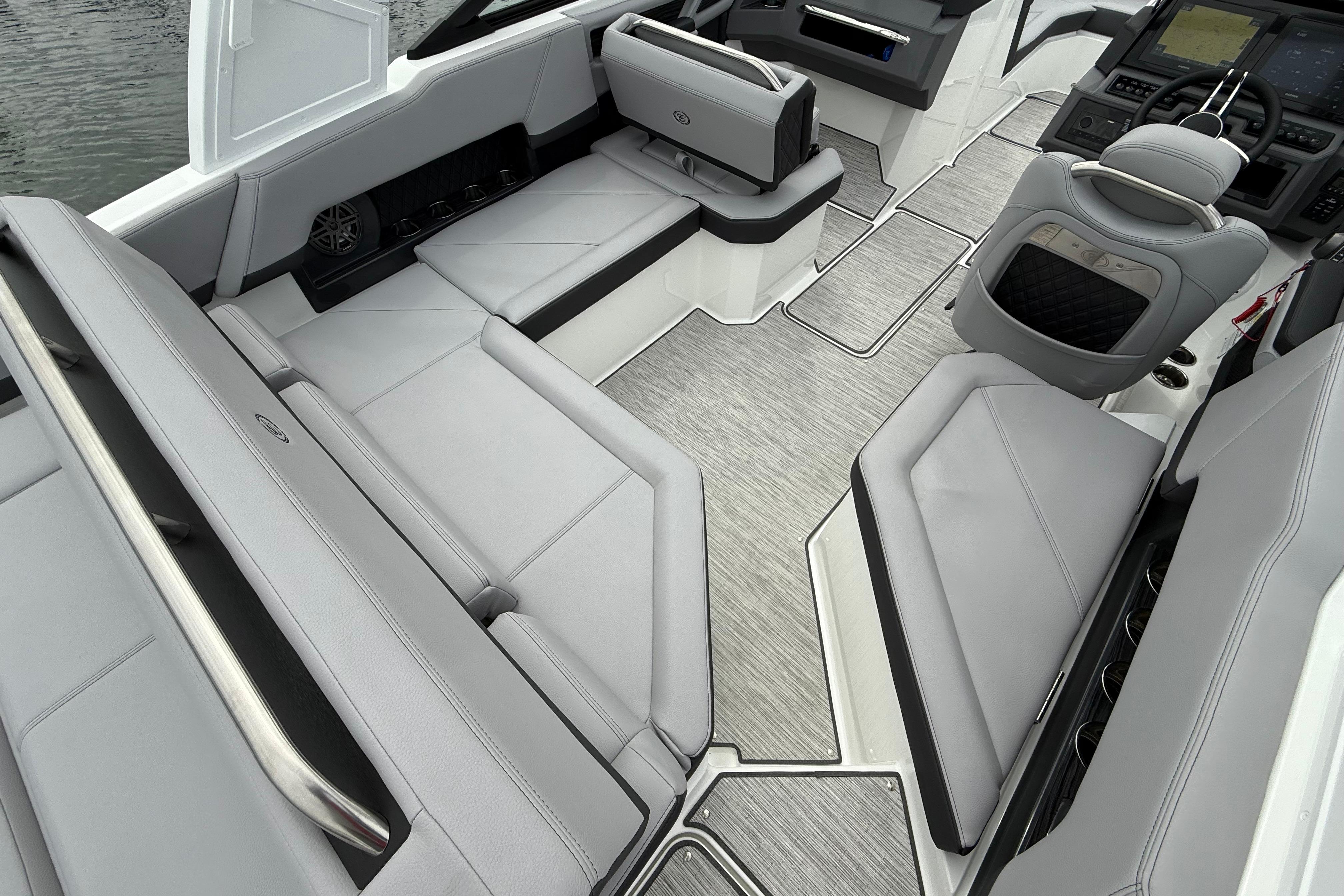 Luxurious interior of 2025 Cobalt R4 boat with sleek gray seating and modern design.