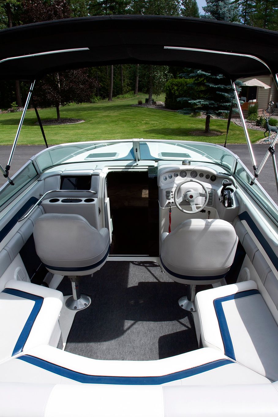 Interior of a 1995 Mirage Trovare 275 boat with white seating.
