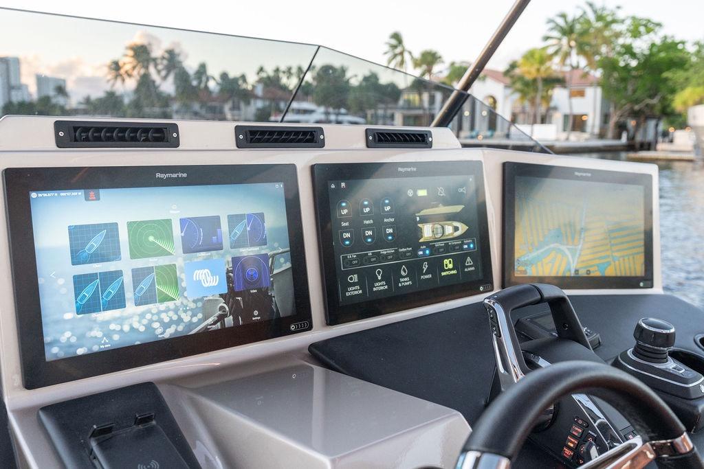 Modern DeKoning 43 yacht dashboard with advanced navigation screens, 2023 model.