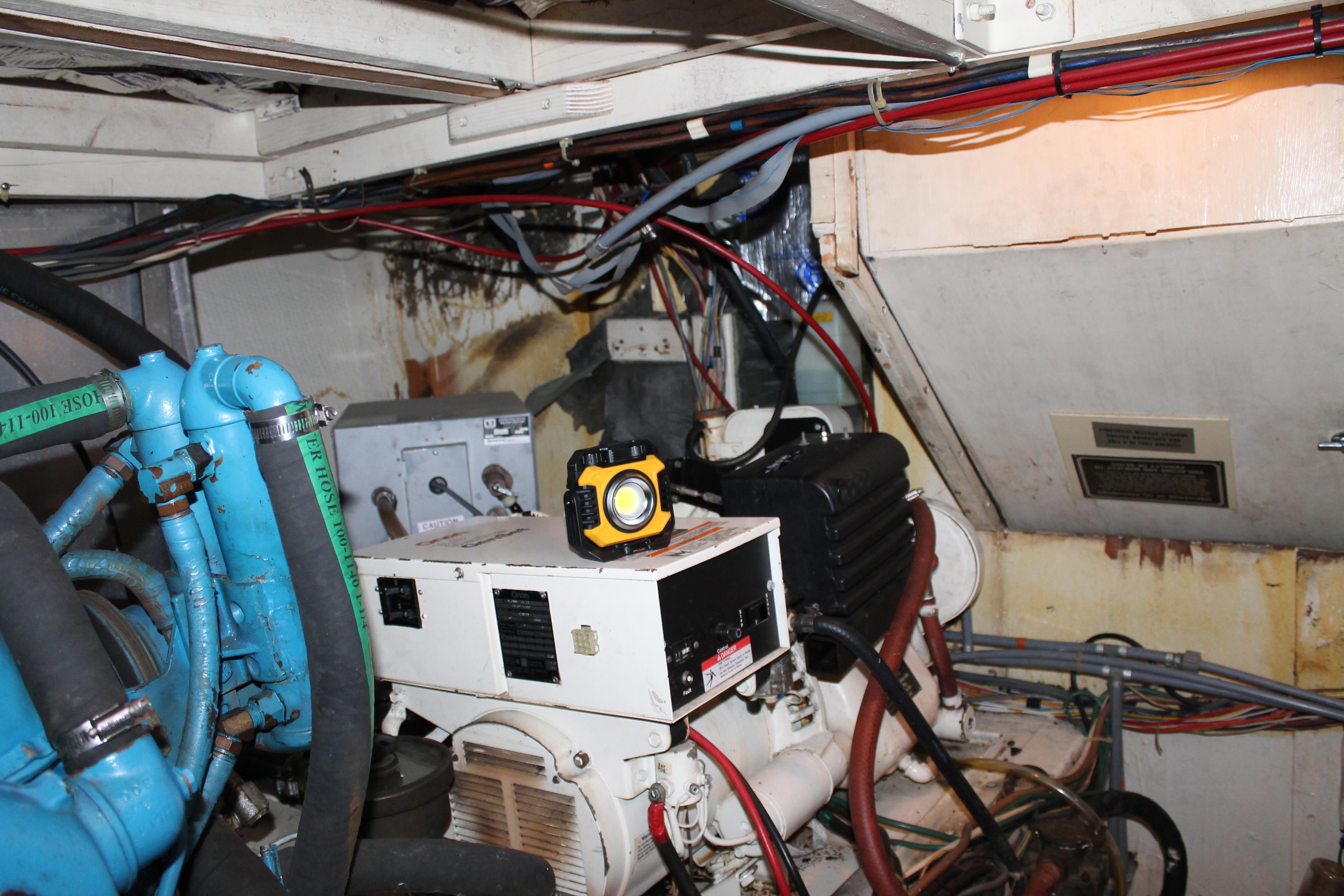 Engine room of 1987 Chris-Craft 427 Catalina with visible machinery and wiring.