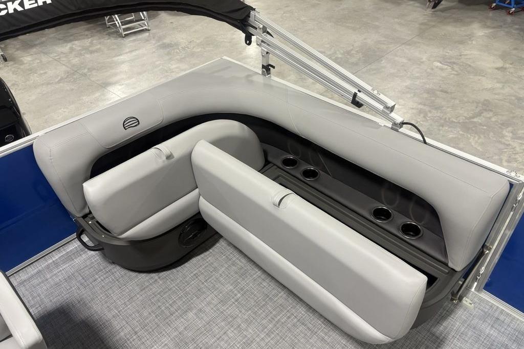 2026 Sun Tracker Party Barge 16 DLX interior seating with cup holders and storage.