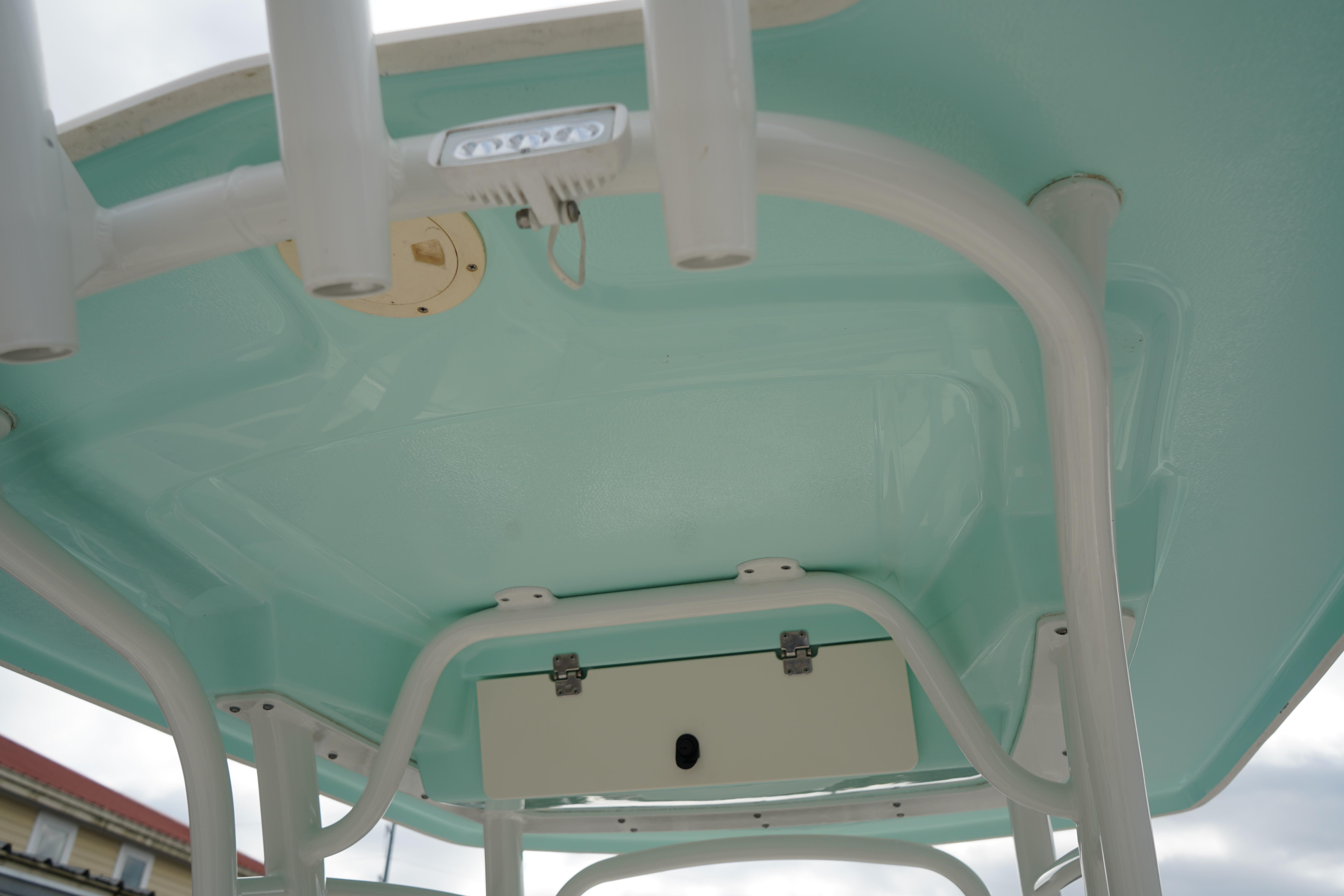 2023 Robalo R222 Center Console boat's T-top structure, featuring a light blue finish.