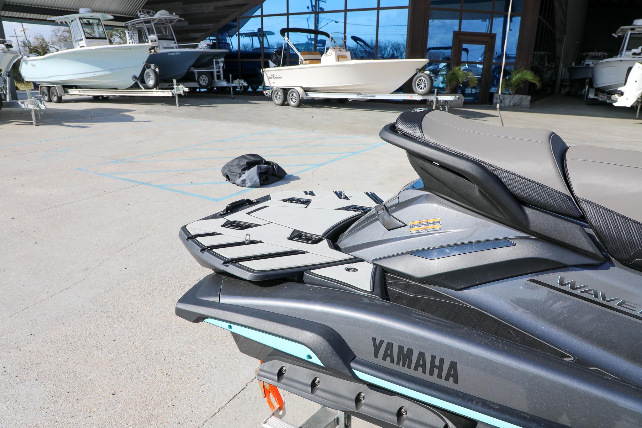 2025 Yamaha WaveRunner FX HO jet ski displayed at a marina with boats in the background.