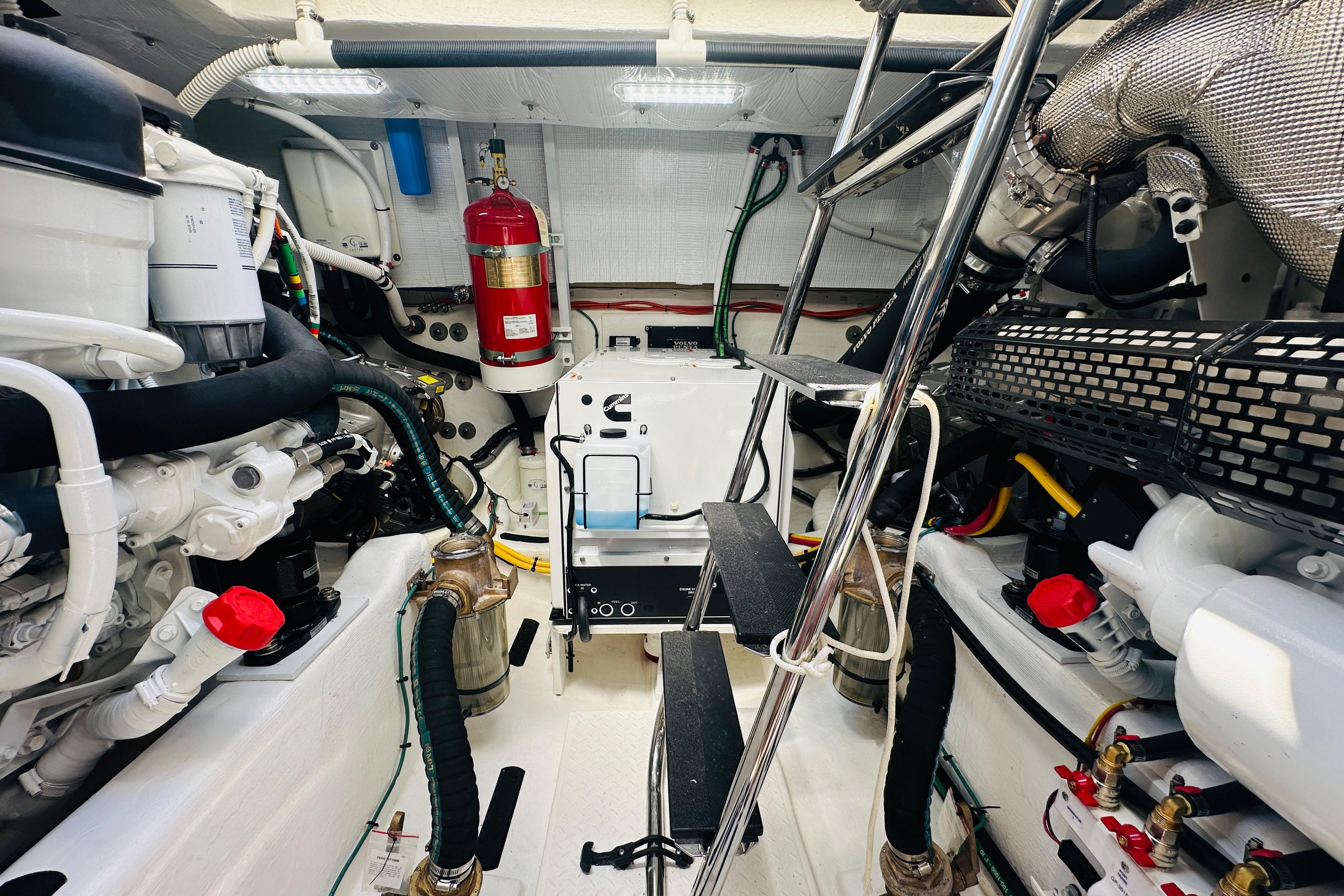Engine room of 2025 Sabre 48 Salon Express, featuring modern equipment and organized layout.