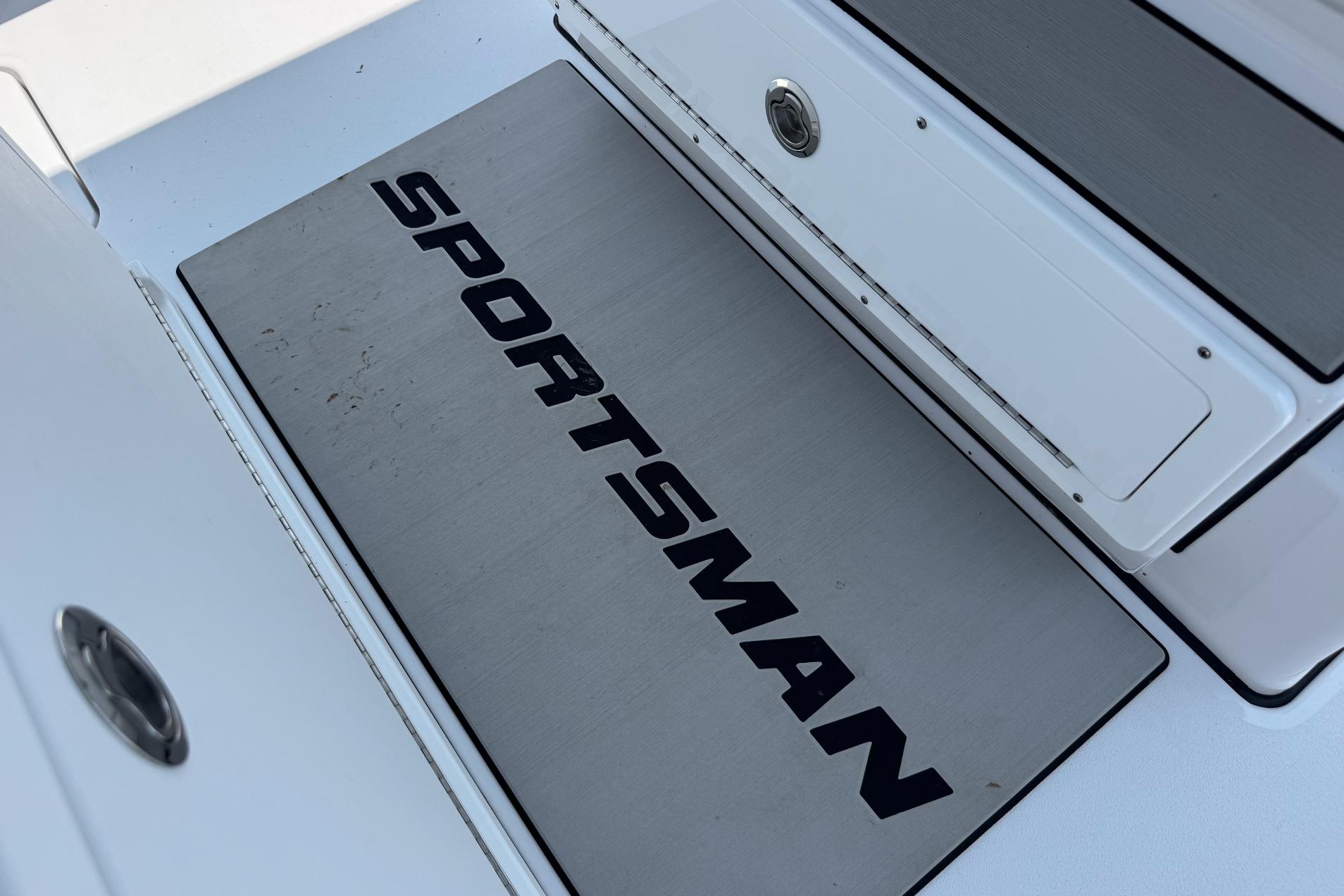 2026 Sportsman Open 262 Center Console boat deck with logo detail.