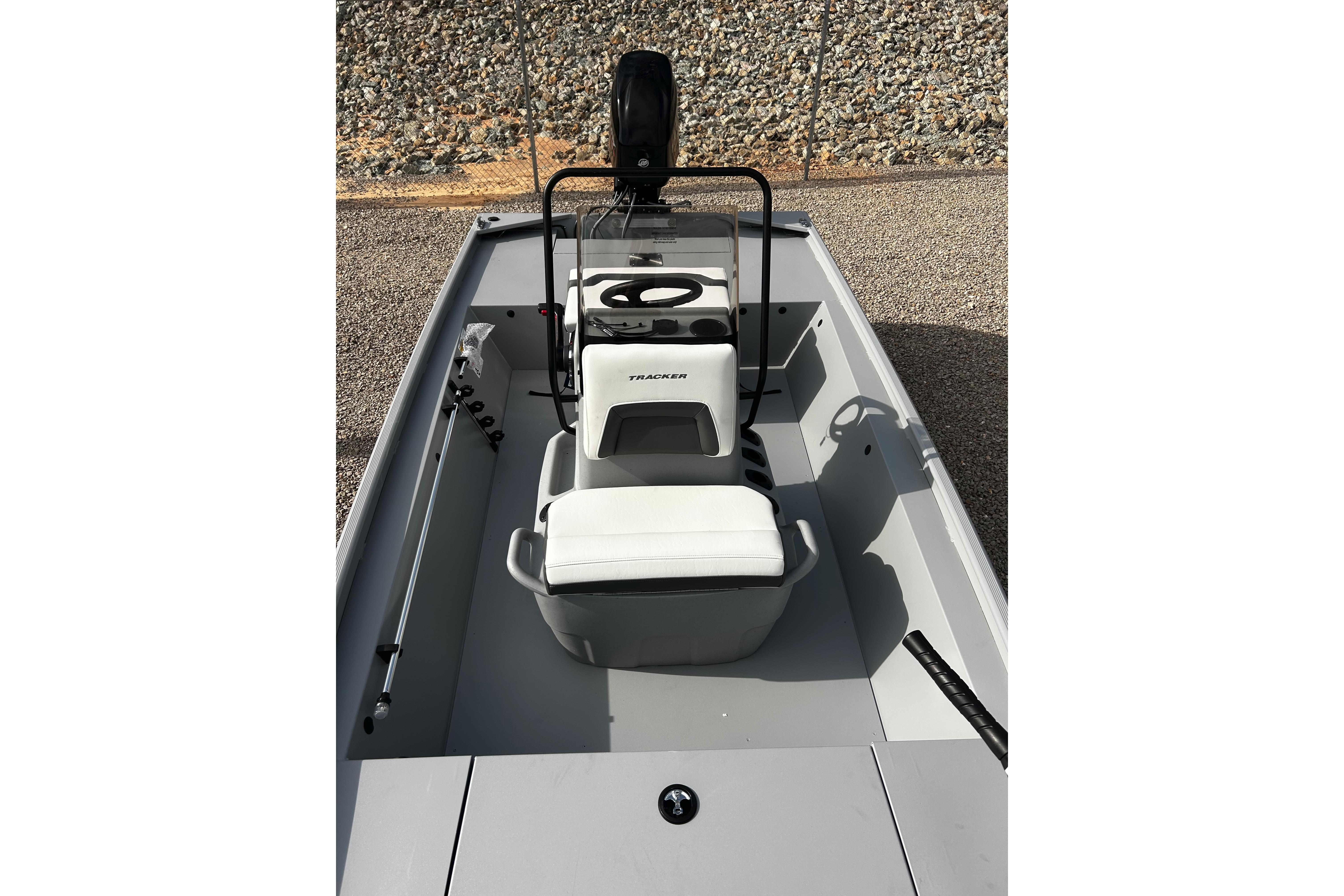 2026 Tracker Bass Tracker Classic CC boat interior with seating and steering console.