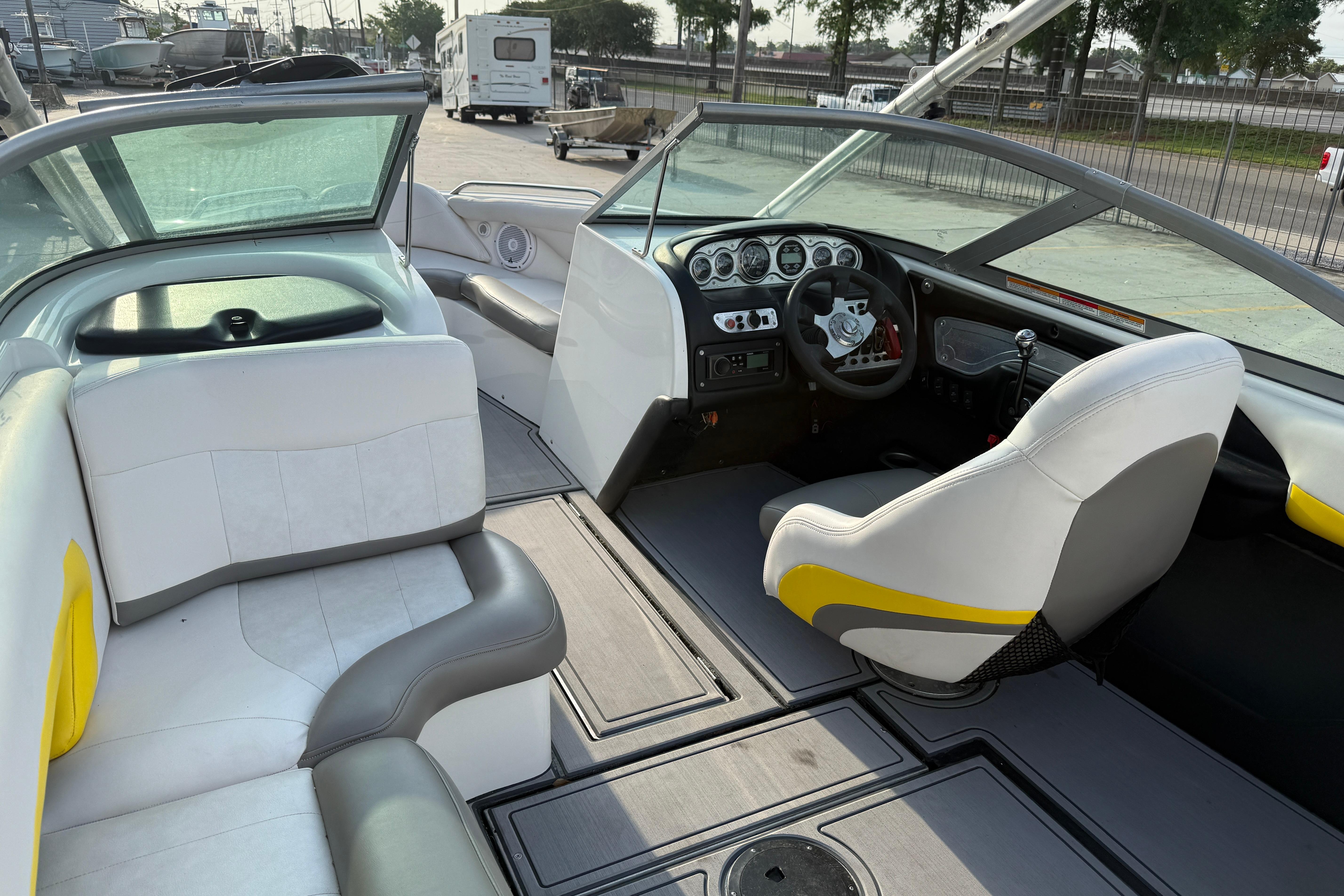 Interior of a 2005 MasterCraft X10 boat with white and gray seating.