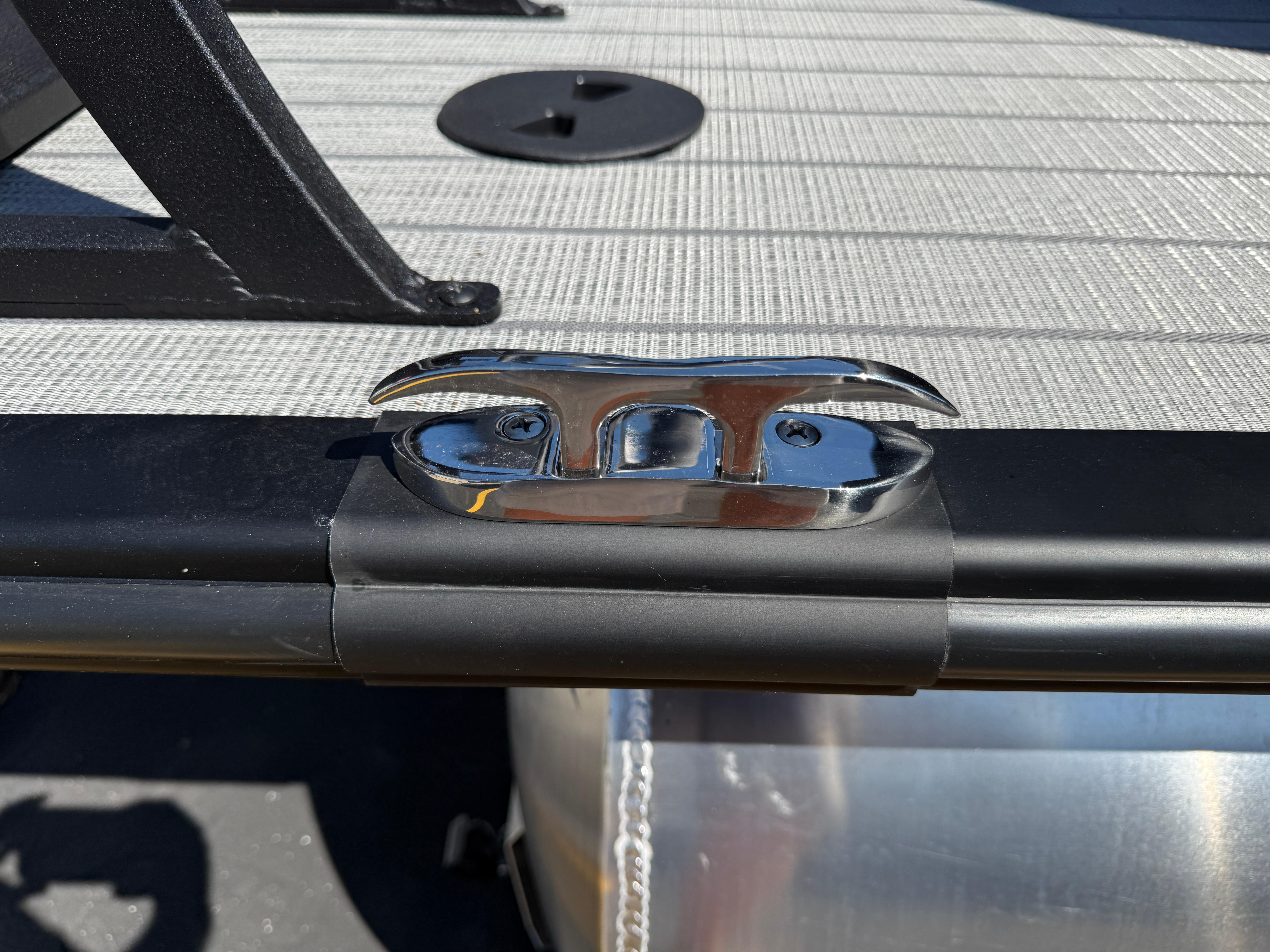 2026 Bentley Pontoons Legacy 223 Navigator deck with chrome cleat detail.