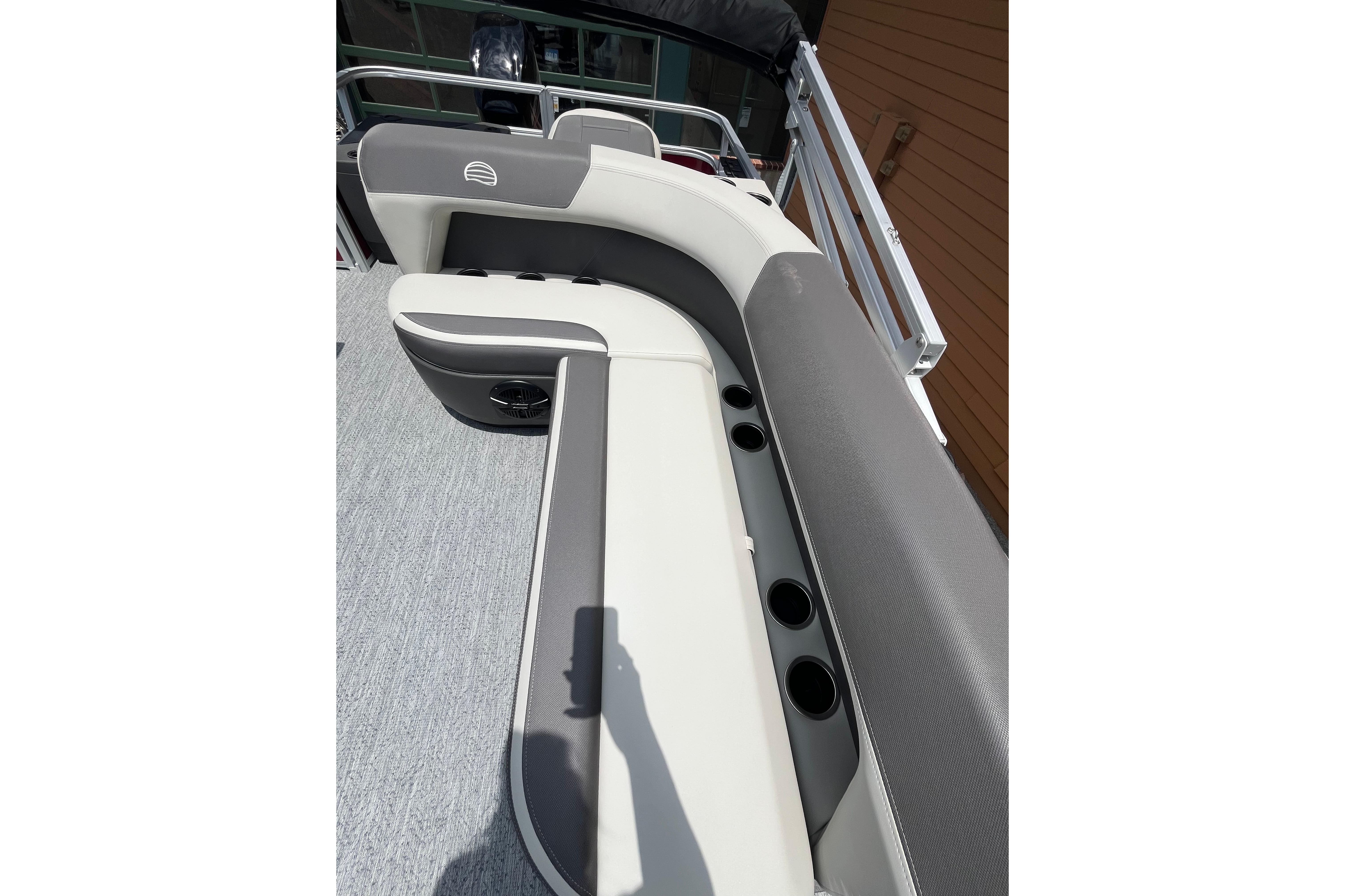 2026 Sun Tracker Bass Buggy 18 DLX boat interior with cushioned seating and cup holders.