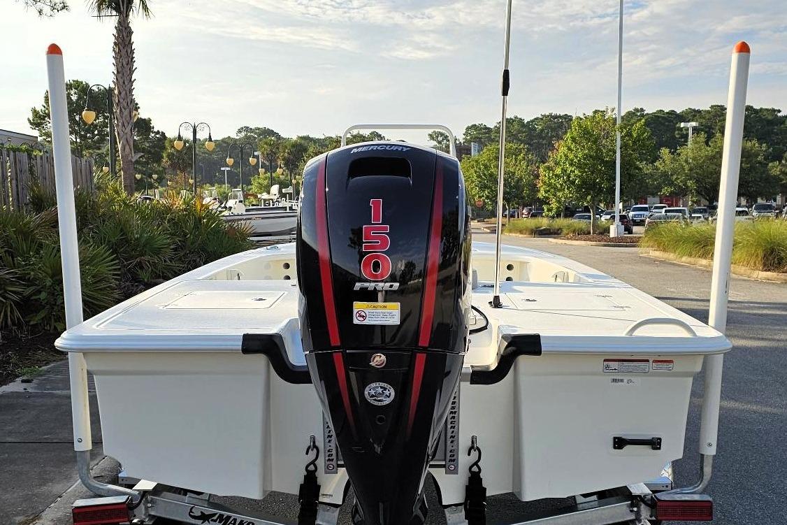 2026 Mako 18 Pro Skiff with Mercury 150 Pro outboard engine, parked outdoors.