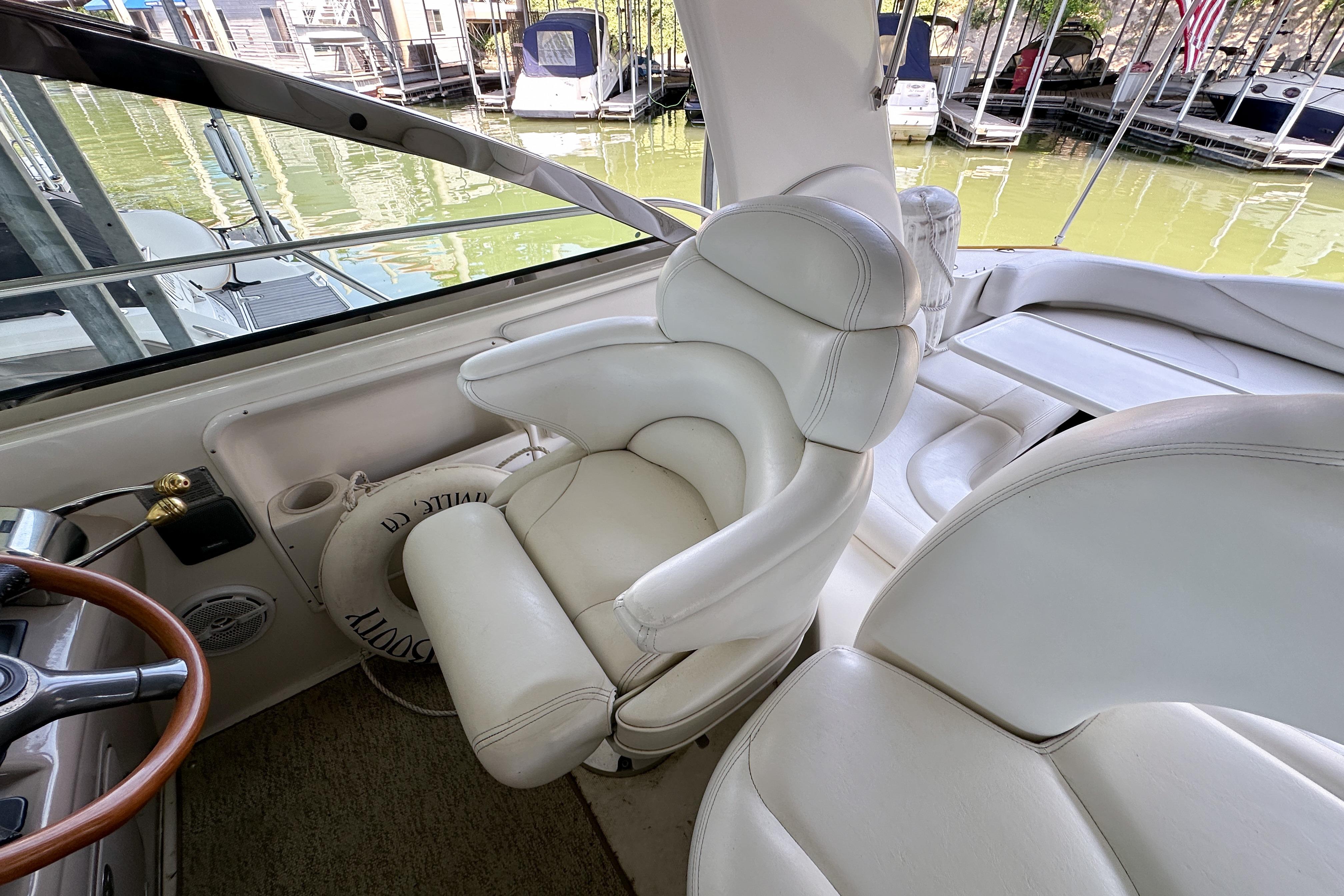 Interior of 2001 Sea Ray 410 Sundancer yacht with plush white seating.