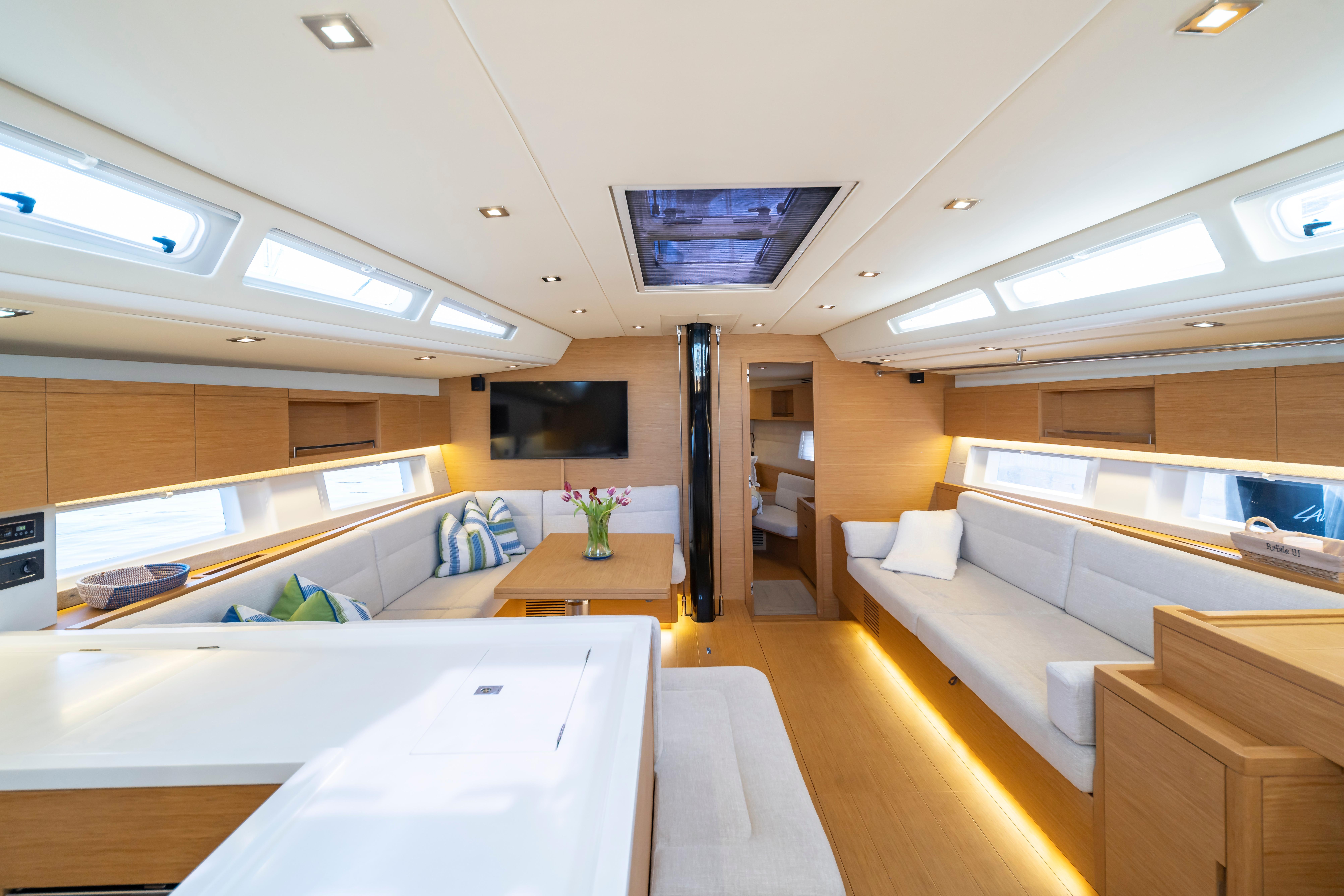 Luxurious interior of 2016 Grand Soleil 58 yacht with modern furnishings and ample natural light.