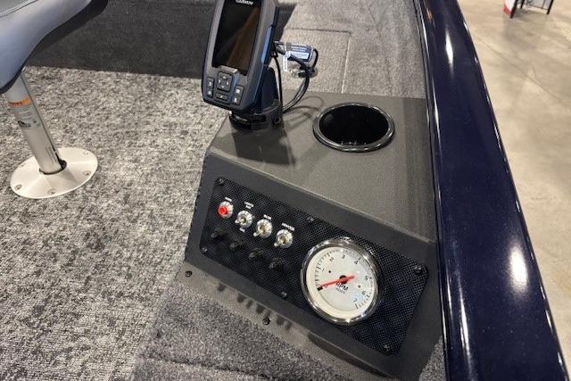 Control panel of 2026 Tracker Super Guide V-16 T boat with gauges and electronics.