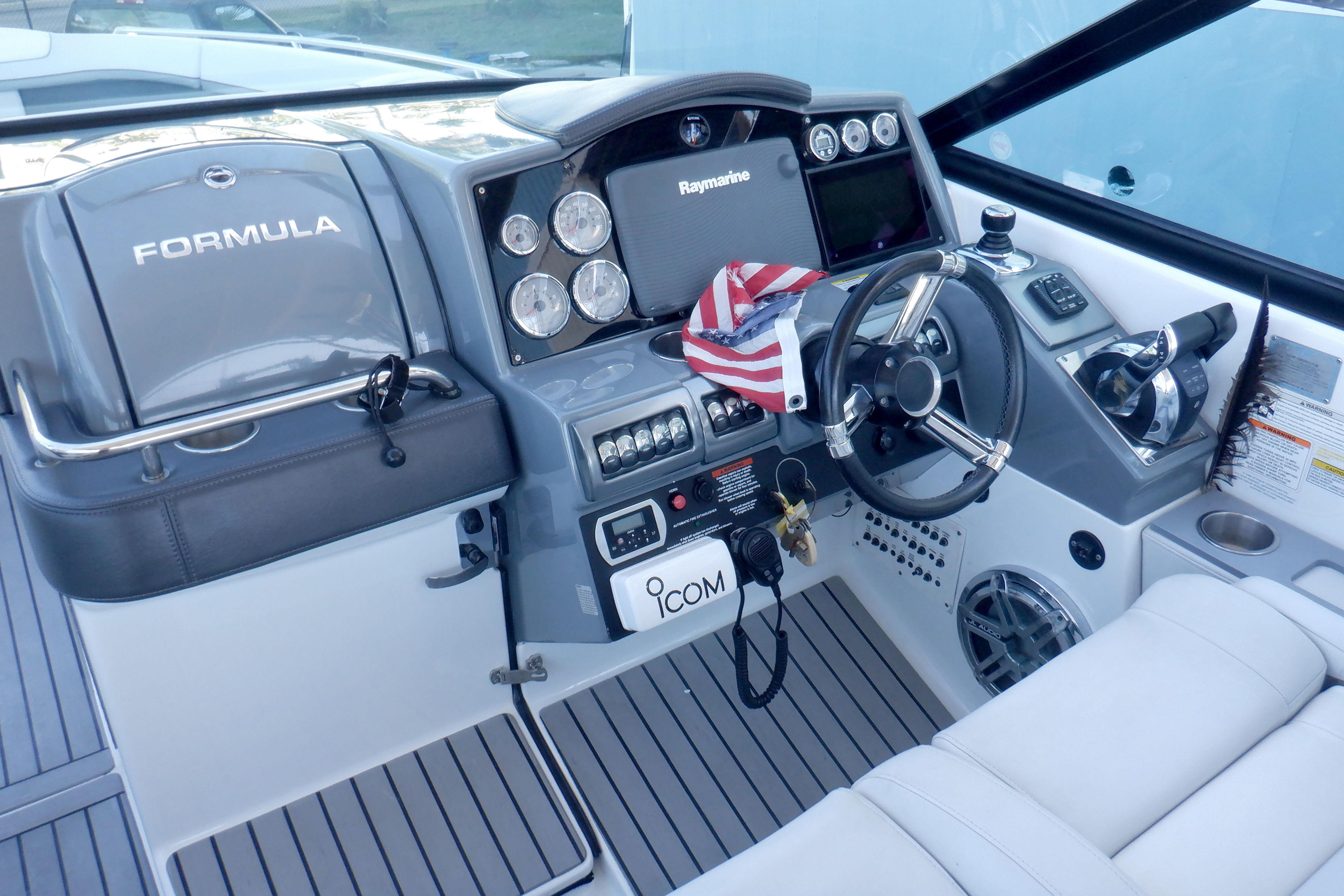 2015 Formula 350 Crossover Bowrider cockpit with steering wheel and navigation controls.