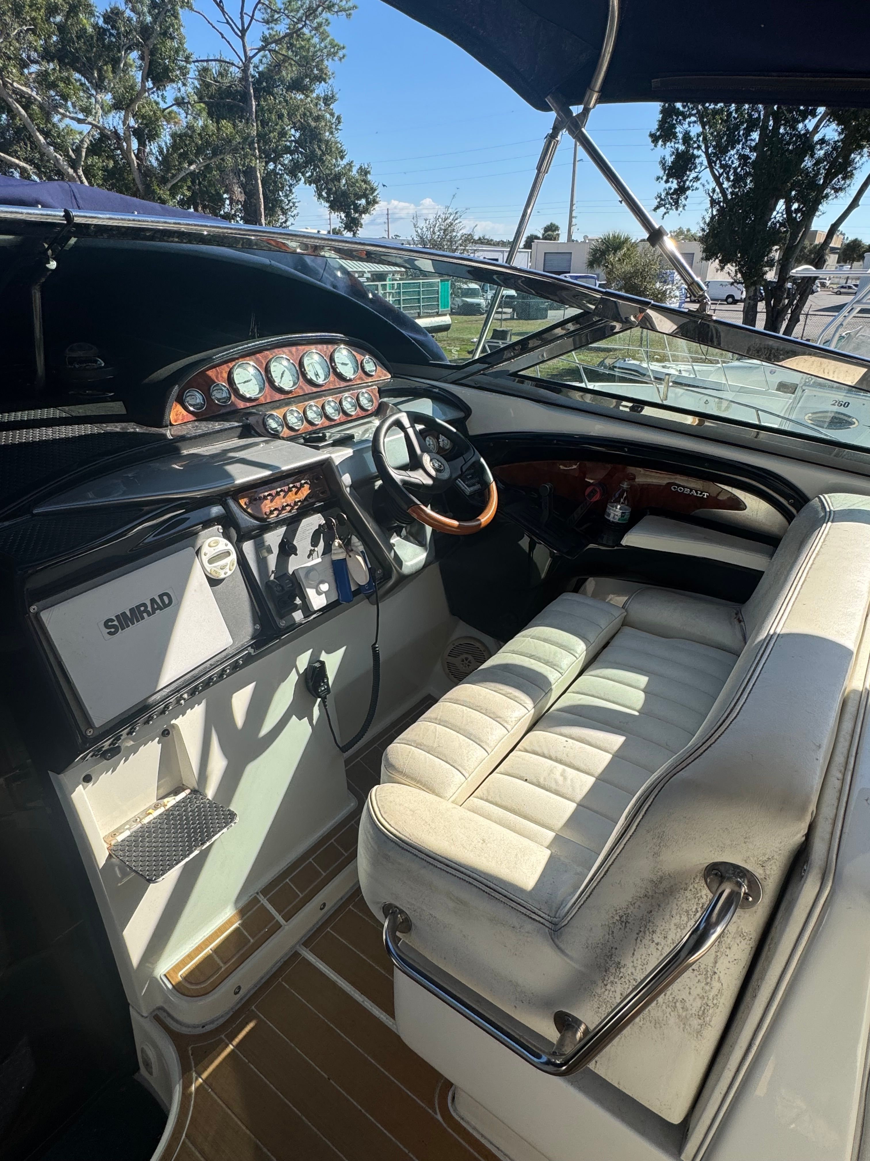 The cockpit of a 2003 Cobalt 360 with a sleek dashboard and comfortable seating.