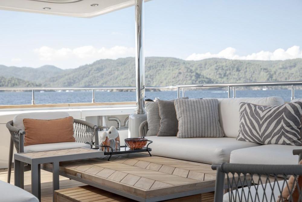 Luxurious yacht deck with comfortable seating, scenic ocean view, CRN 129, 2009 model.