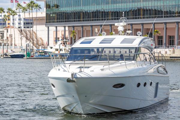 2013 Princess V57 luxury yacht docked in harbor.