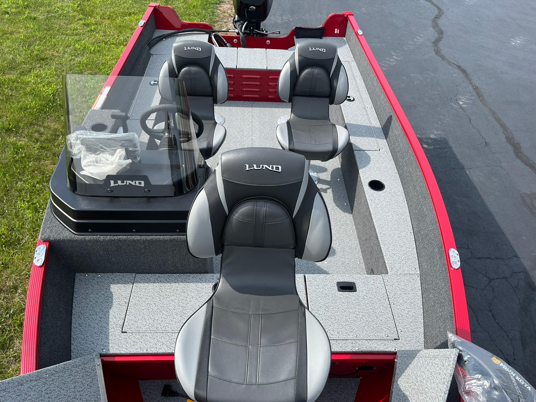 2026 Lund 1650 Angler SS boat interior with three seats and steering console.