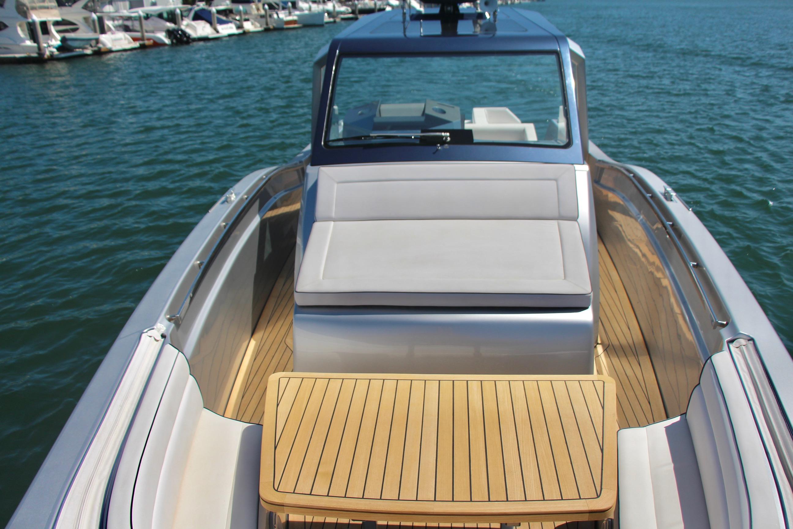 2017 Maori 50 yacht with teak deck and luxurious seating, docked at marina.