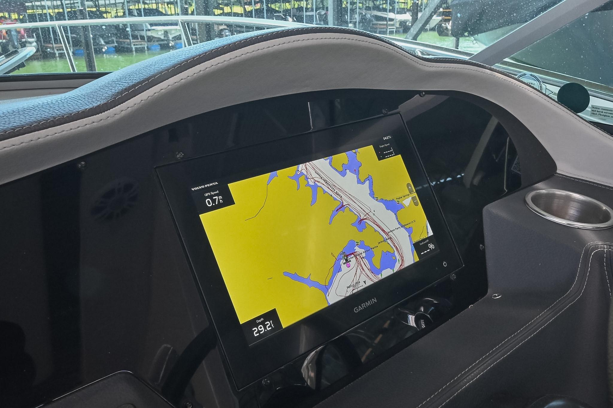 Dashboard of a 2021 Regal 33 Express boat featuring a Garmin navigation display.