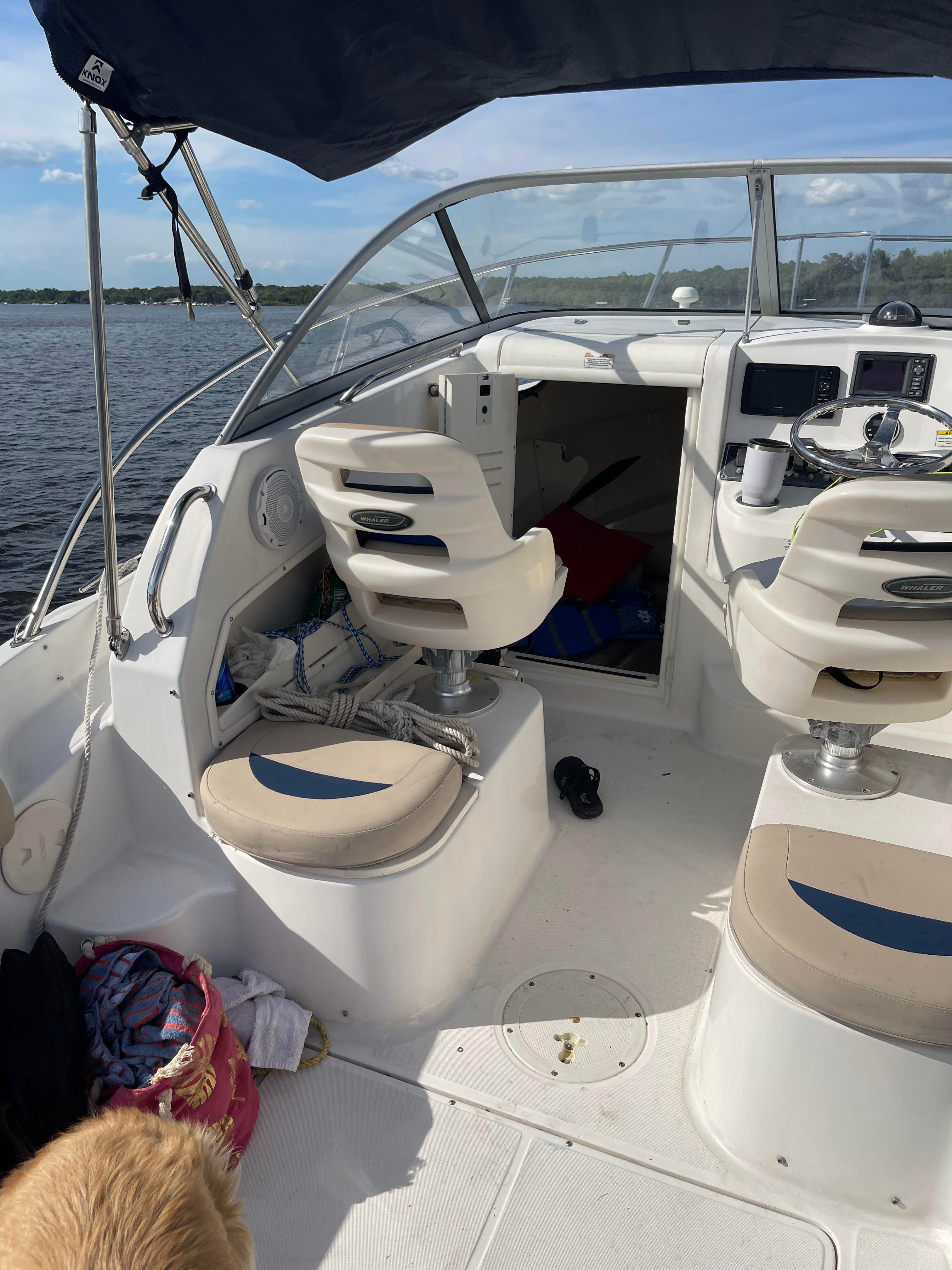 Interior of a 2010 Boston Whaler 235 Conquest boat on the water.