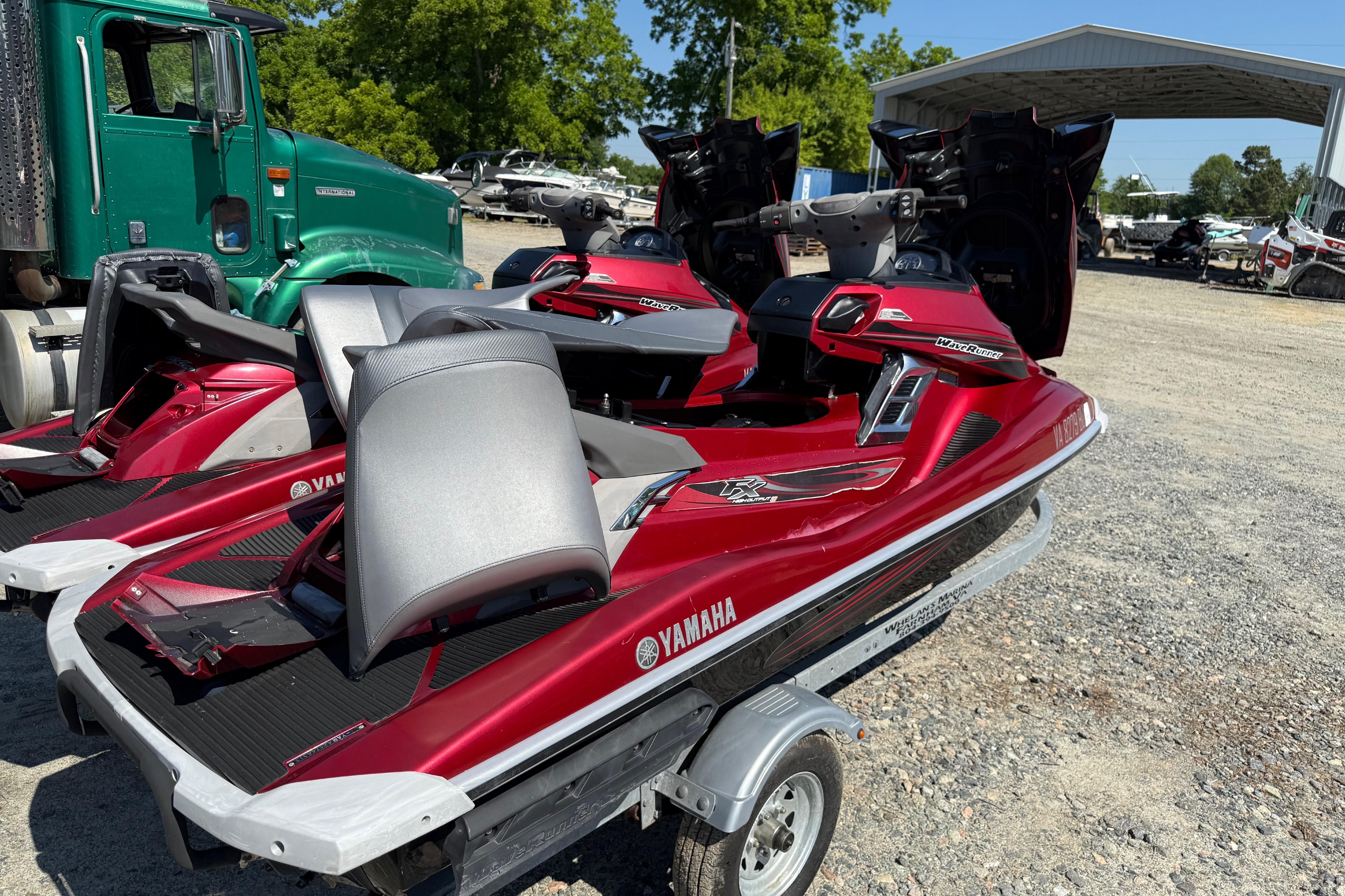 2013 Yamaha WaveRunner FX HO jet skis on a trailer, parked outdoors.