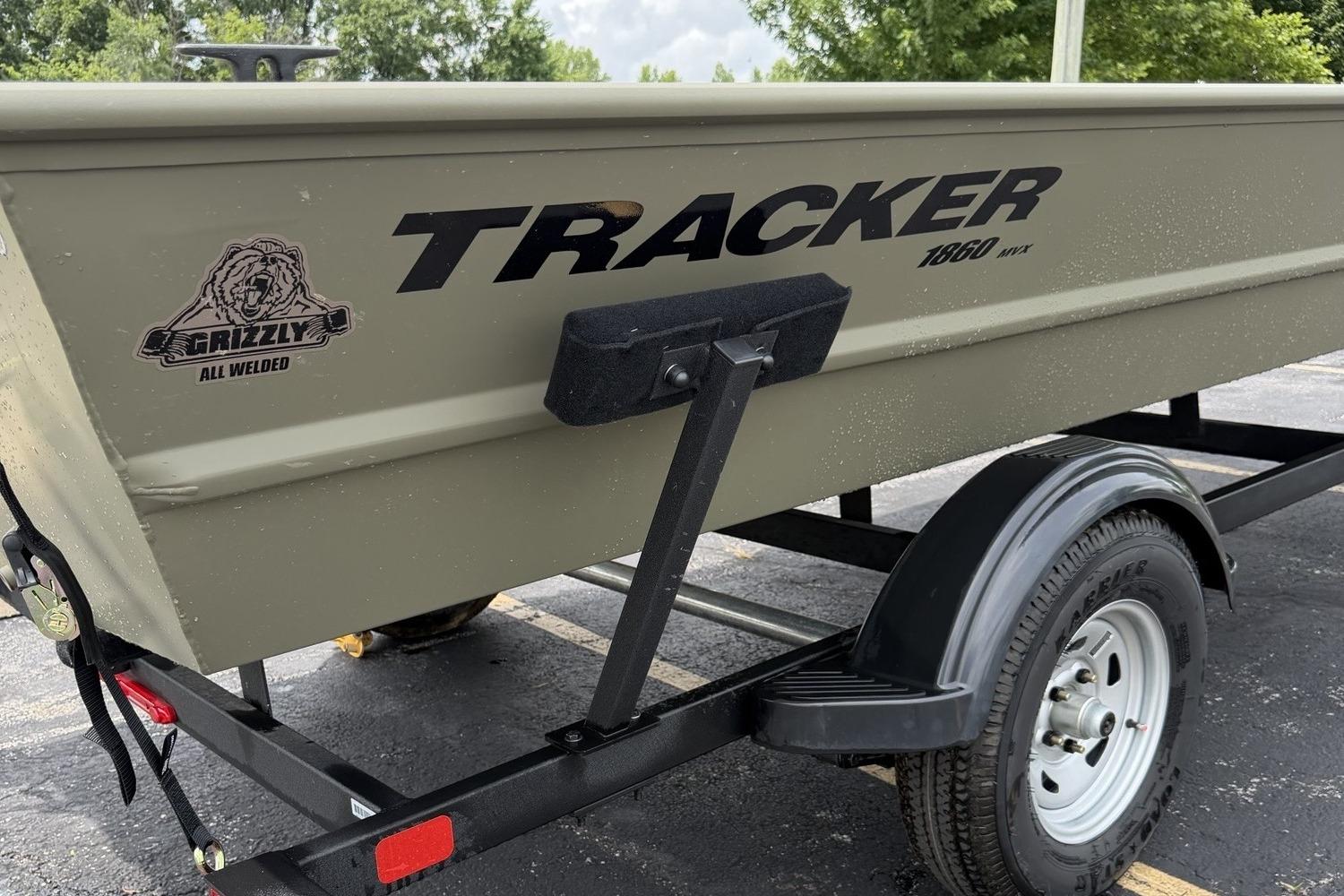 2026 Tracker Grizzly 1860 Utility boat on trailer, showcasing rugged design and branding.
