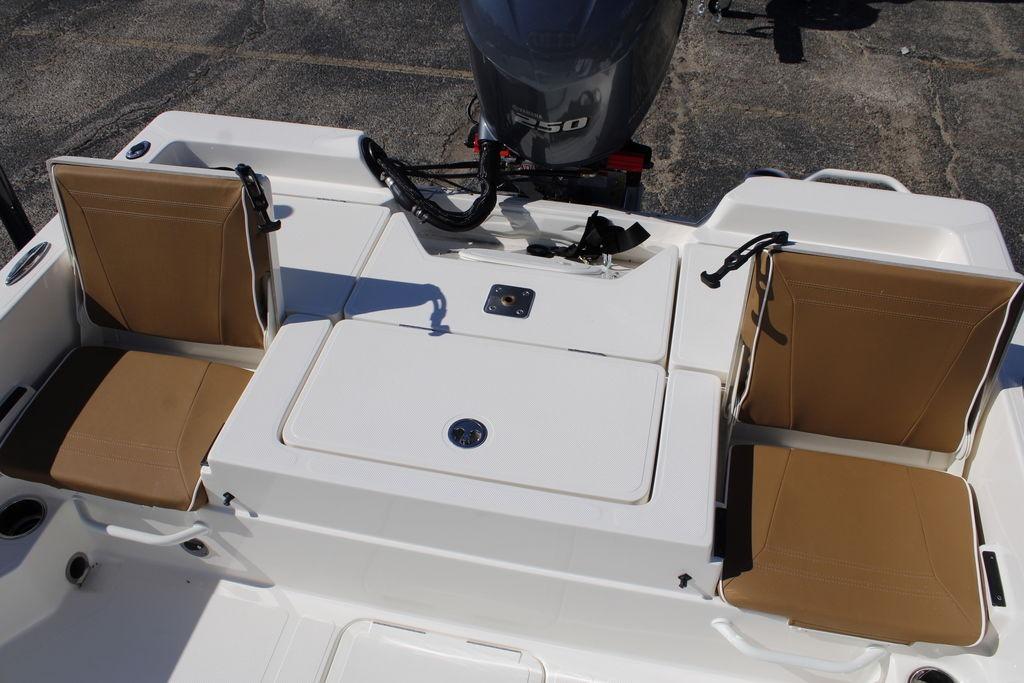2026 Skeeter SX230 boat with tan seats and outboard motor.